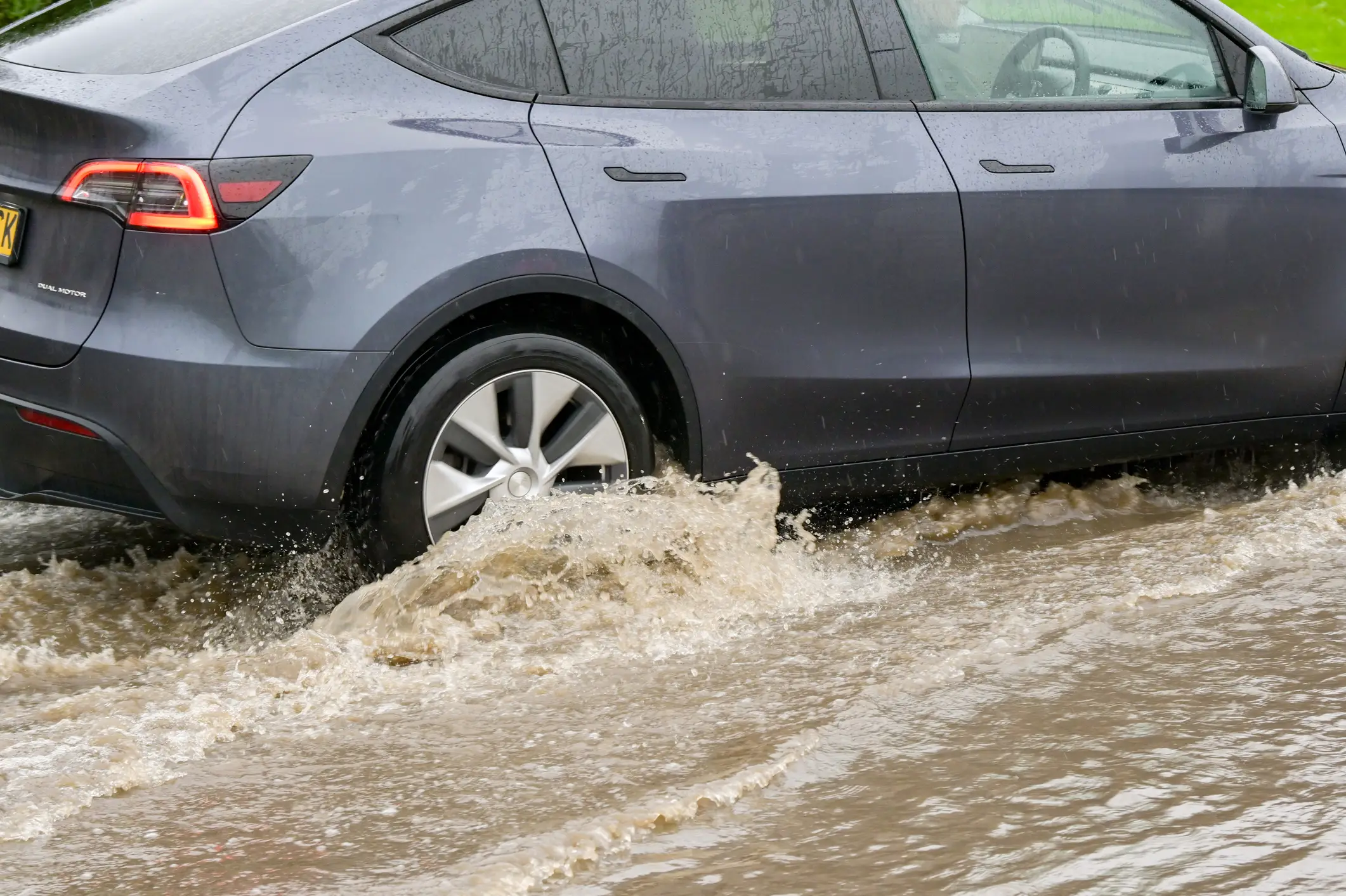 The expert says that you shouldn't drive through flood water that goes past the center of your wheels (Getty Stock)