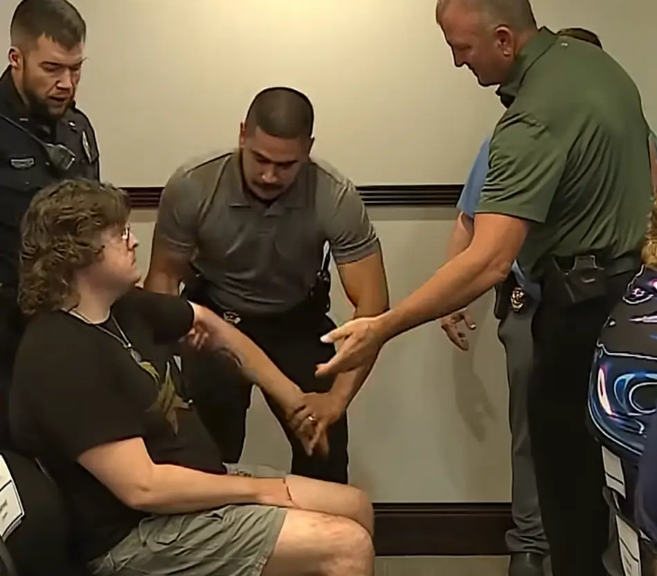 Lux Claridge had to be physically removed from the meeting (WIBW)