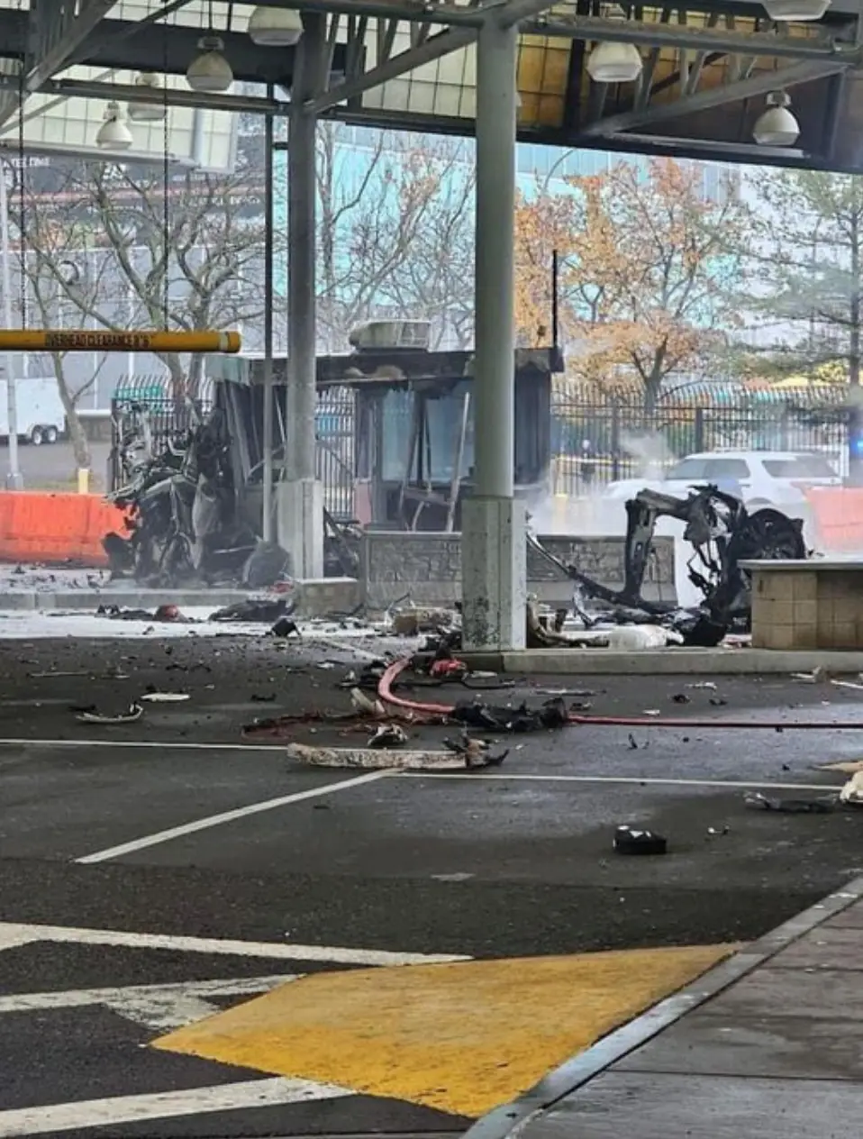 Photos of the scene show a fire and debris on the ground.