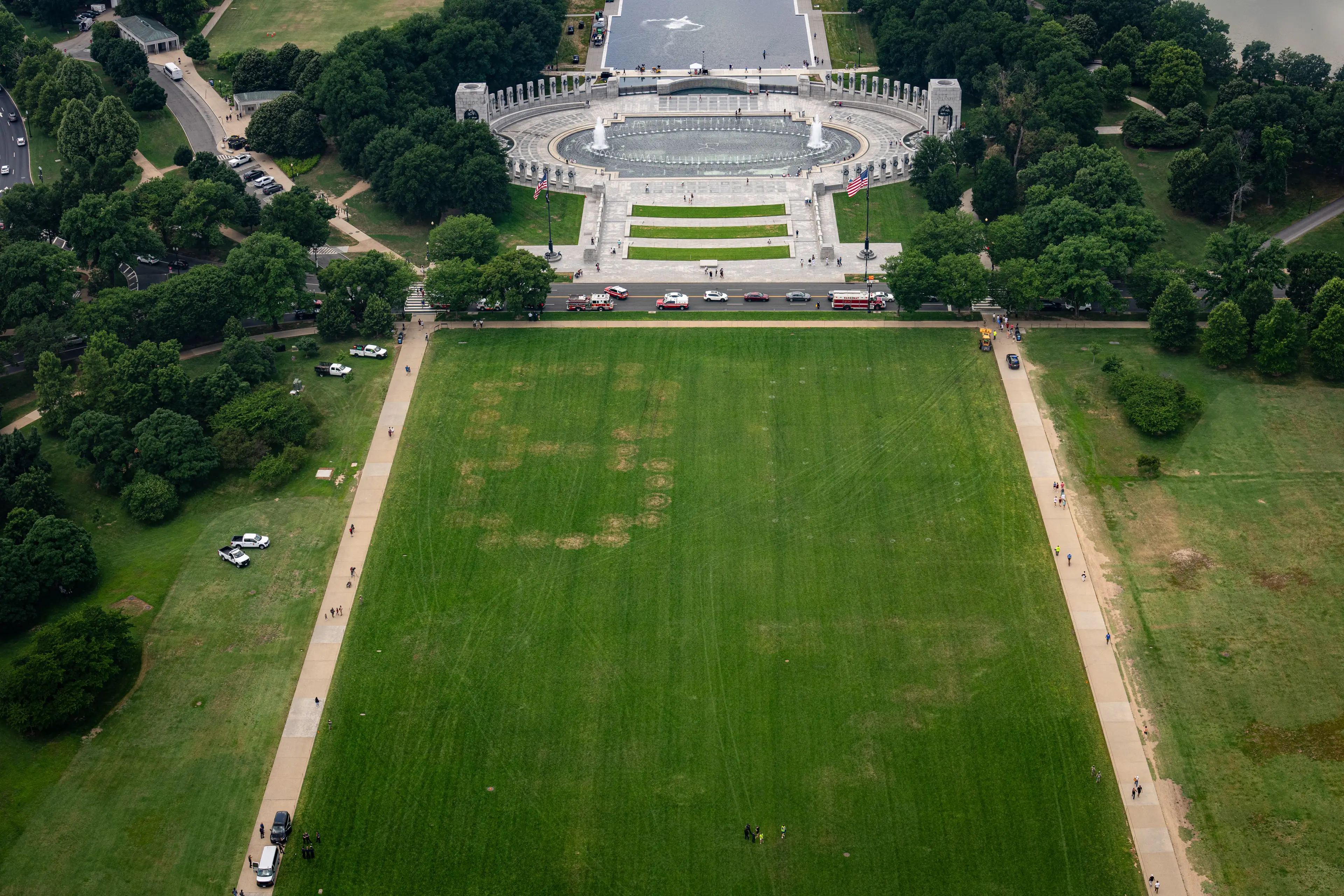 The numbers "86 47" are burned into the grass on the National Mall between the Washington Monument and the World War II Memorial (Al Drago/Bloomberg via Getty Images)