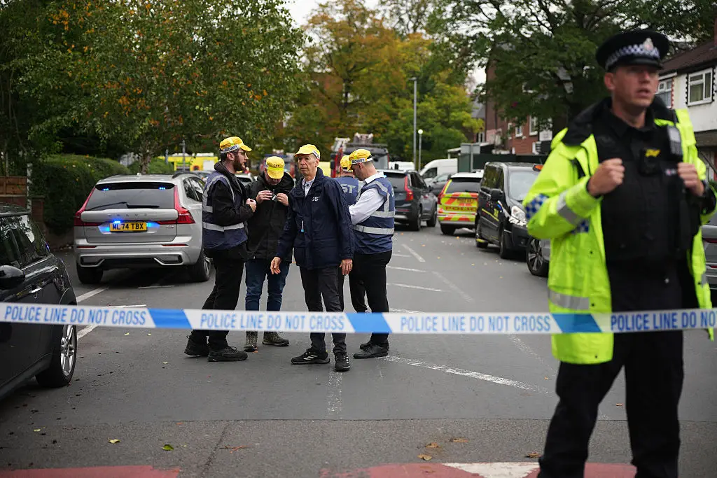 Police and community security guards gather near the Heaton Park Hebrew Congregation Synagogue, where multiple were injured after stabbing and car attack, in north Manchester (Christopher Furlong/Getty Images)