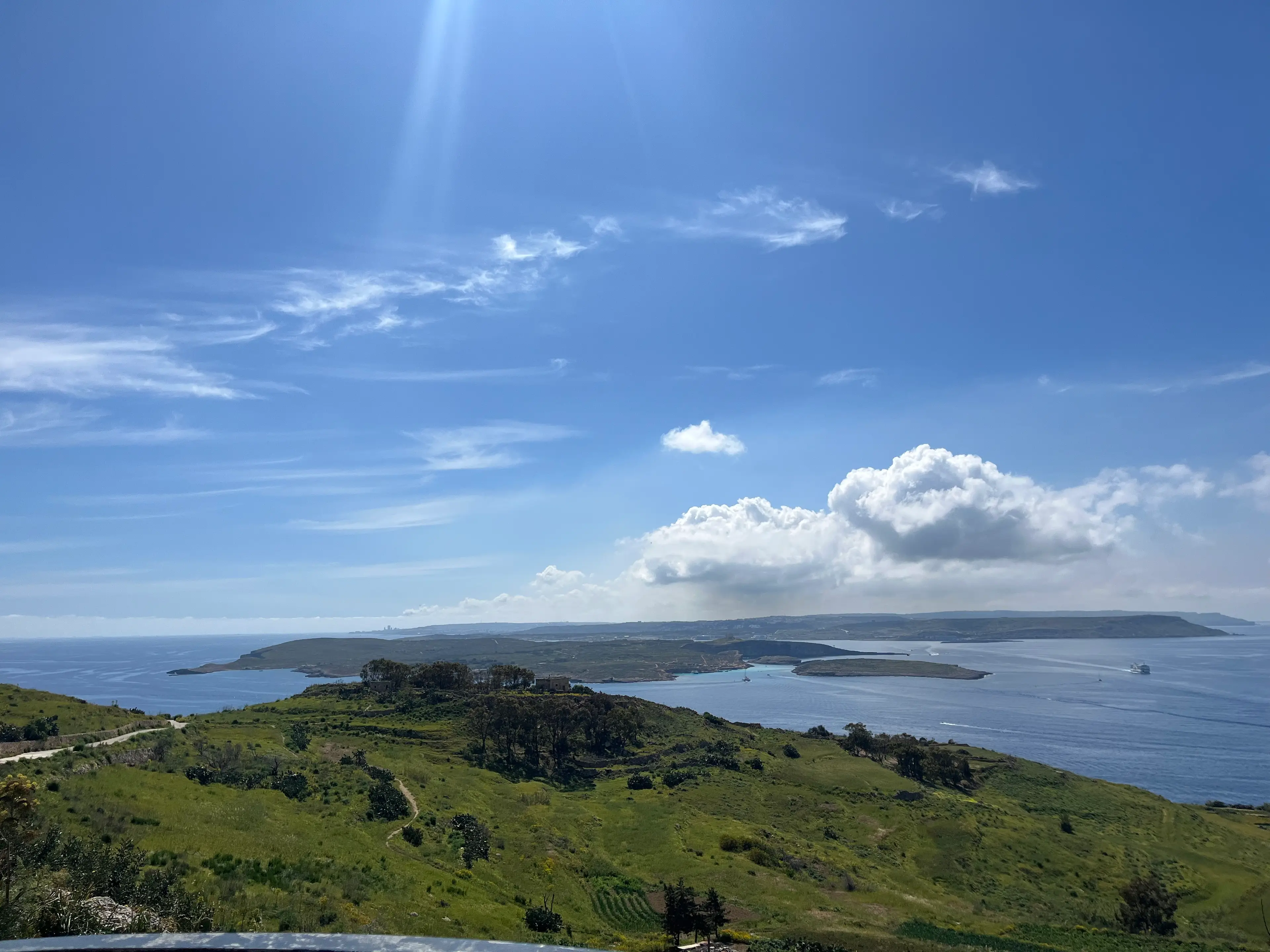 A view of mainland Malta in the distance, with the island of Comino serving as a buffer between Malta and Gozo - where the snap was taken (LADbible)