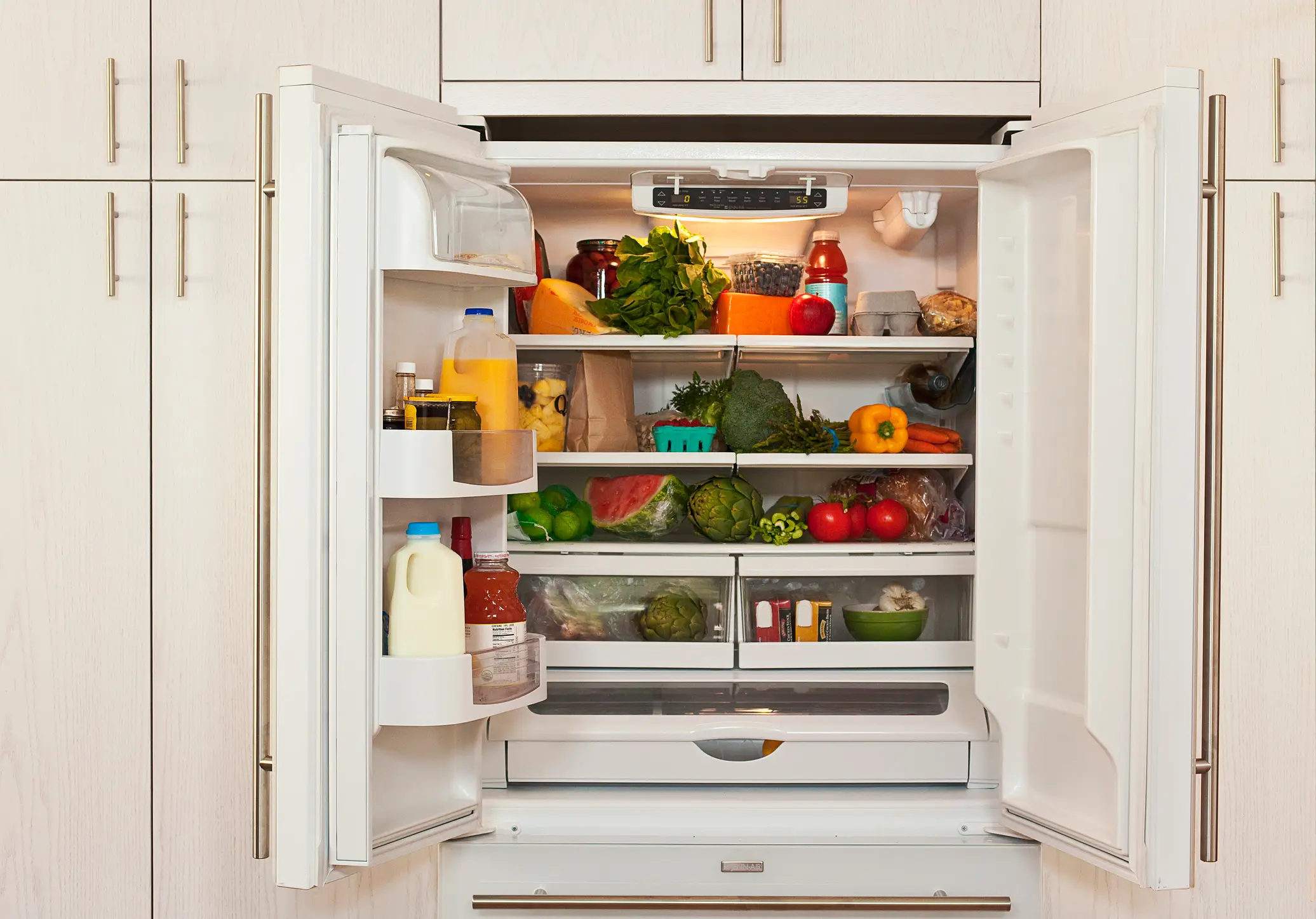 Apparently milk shouldn't be put in the fridge door (Getty Stock)