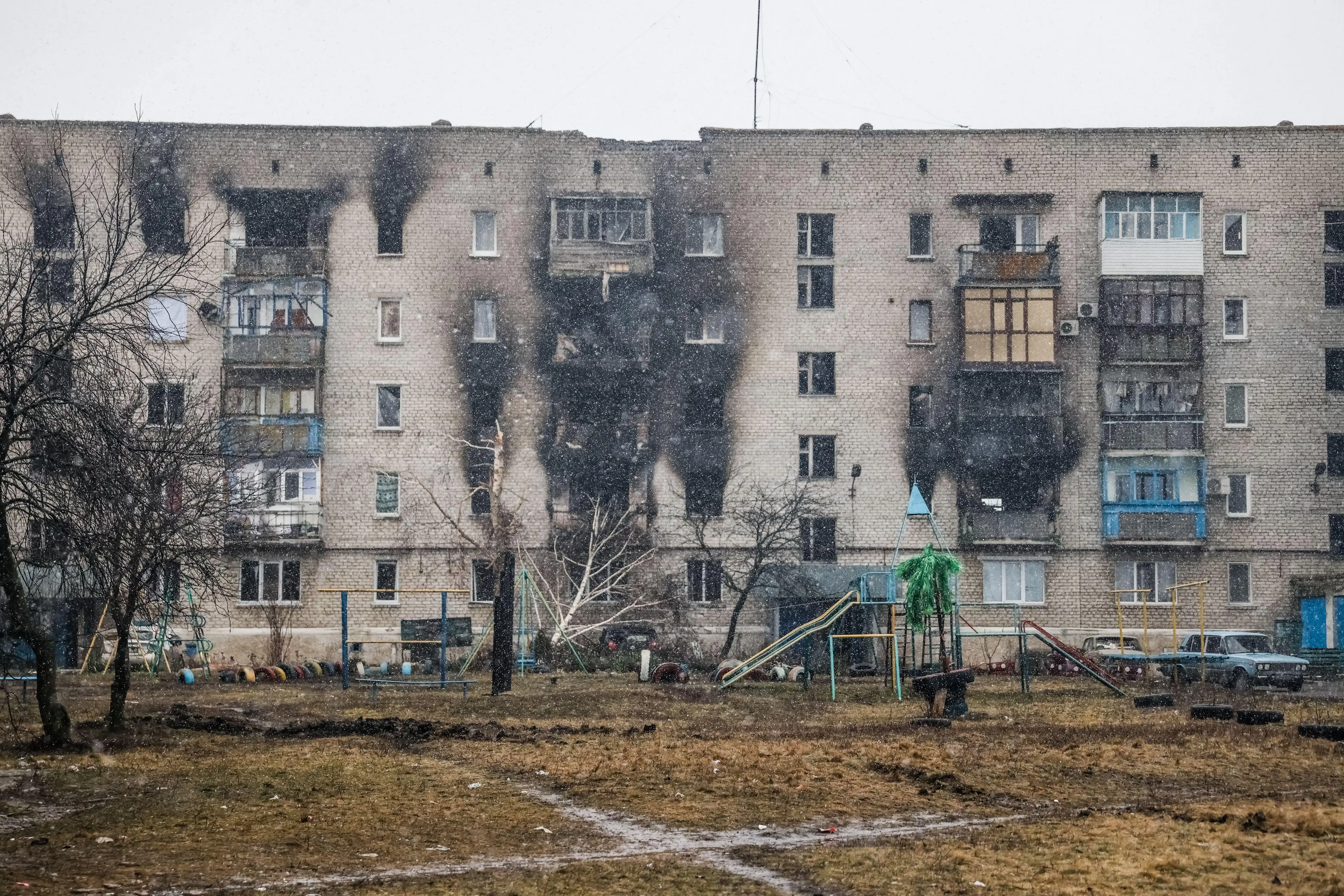 Apartment buildings damaged in shell attacks (Alamy)