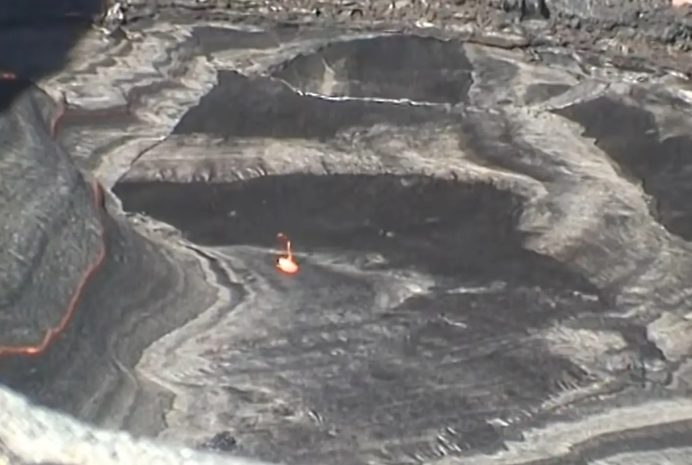 "Oh look it broke the surface, it's made a nice little hole." (YouTube/Photovolcanica)