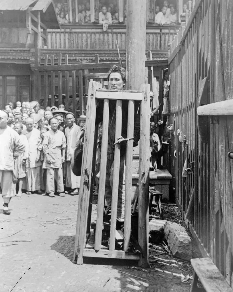 This method of torture was called a cangue (General Photographic Agency/Getty Images)