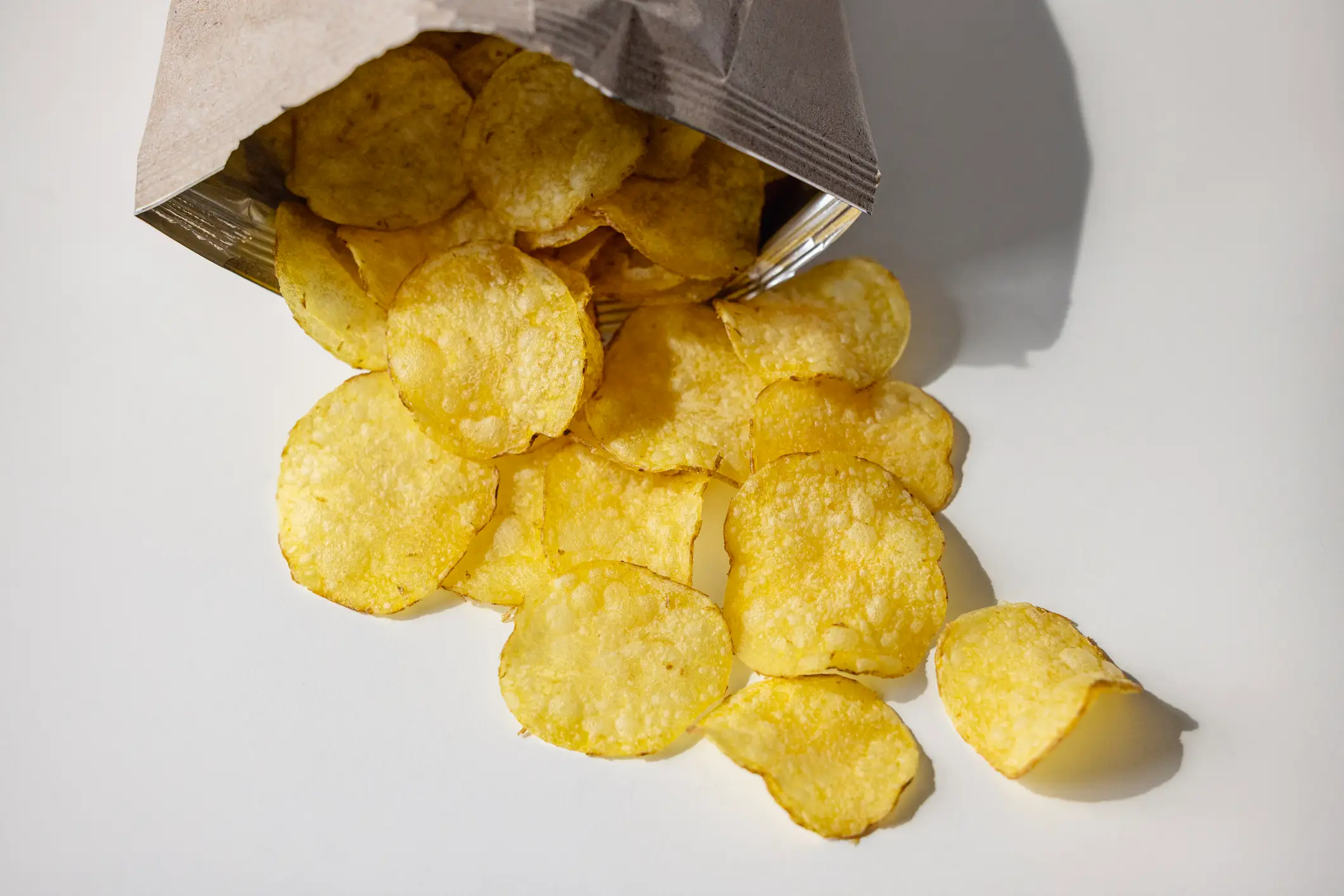 An extra 1 bag of chips per day could increase the risk of dementia (Getty Stock)