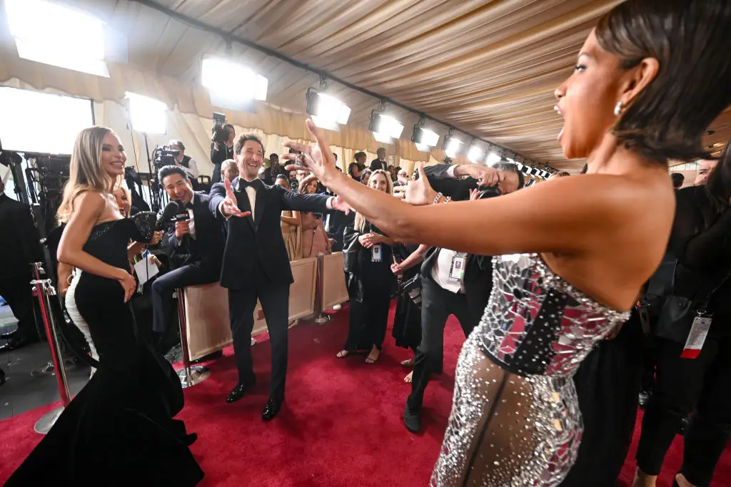 Georgina Chapman watches on as boyfriend Adrien Brody and Halle Berry embrace (Michael Buckner/Penske Media via Getty Images)