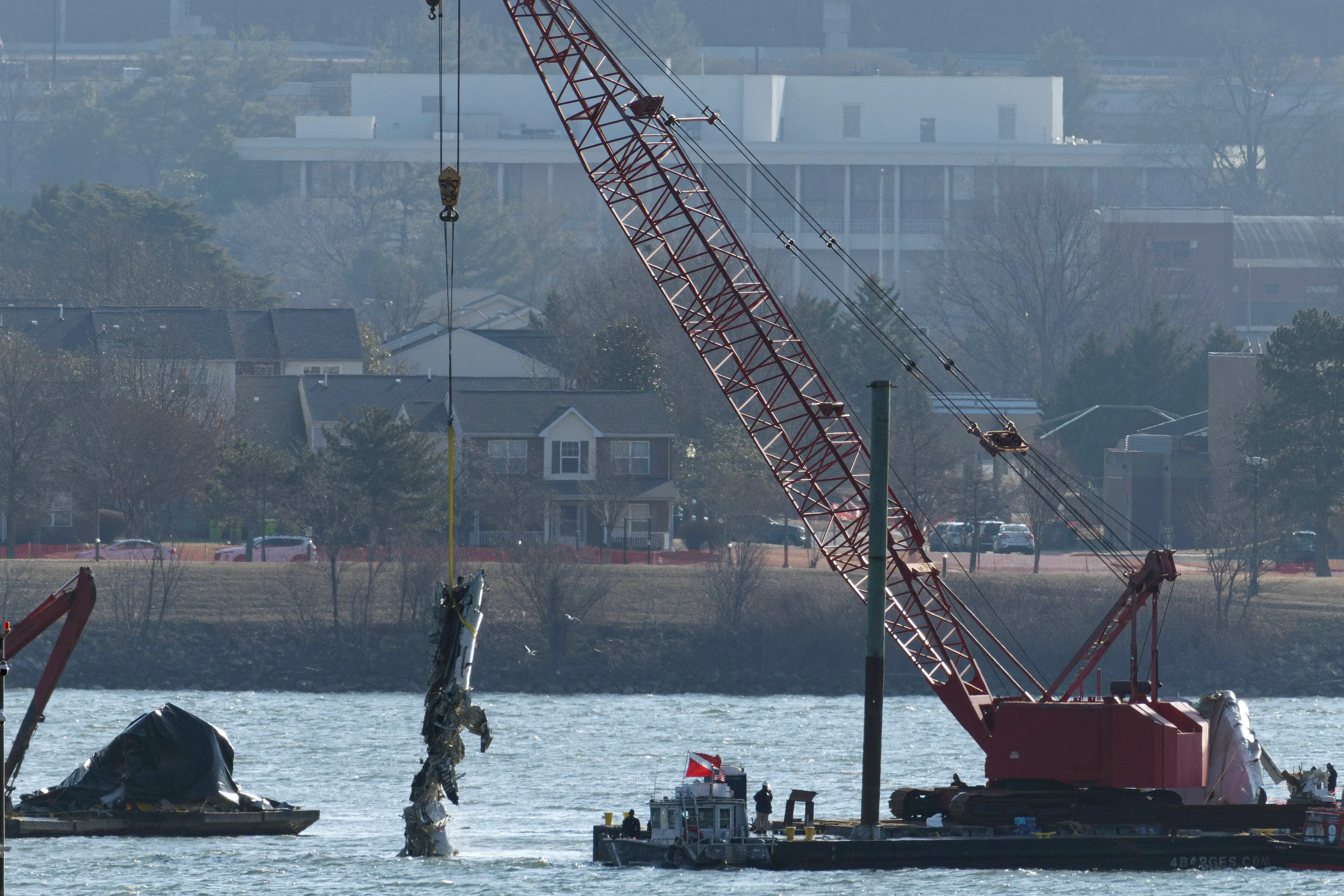 The crushed and twisted wreckage of the regional jet was pulled out of the Potomac the next day (Kayla Bartkowski/Getty Images)