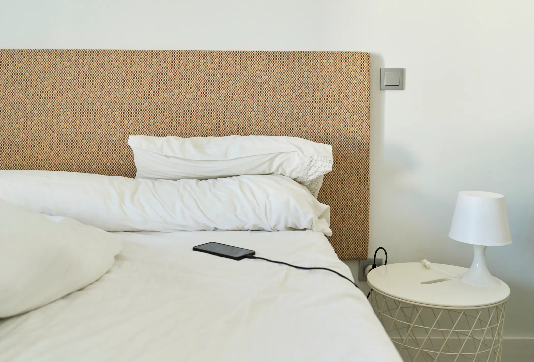 People are being warned not to charge their cellphones on their bed (Getty Stock)