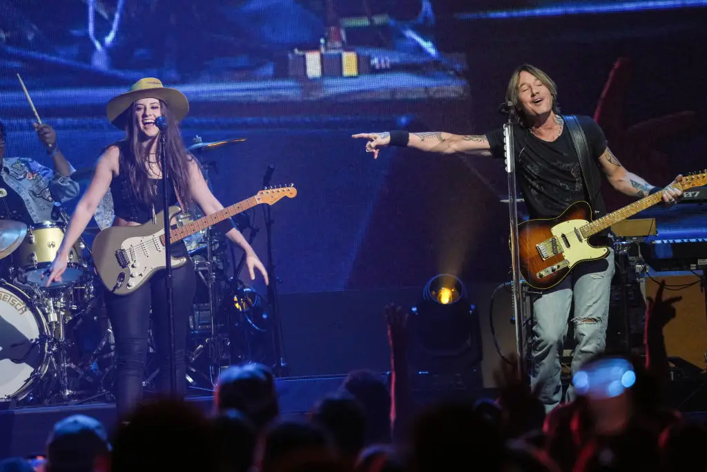 Maggie Baugh and Keith Urban performing at iHeartCountry Festival in May 2024 (Amy E. Price/Getty Images)