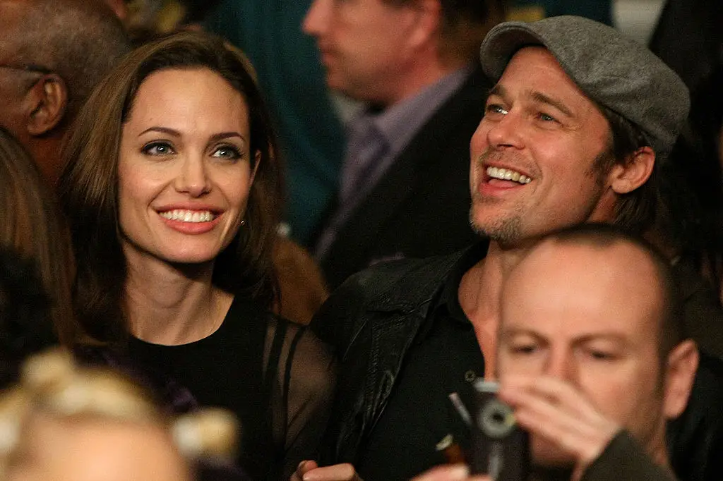 Angelina Jolie and Brad Pitt have reached a divorce settlement (Al Bello/Getty Images)