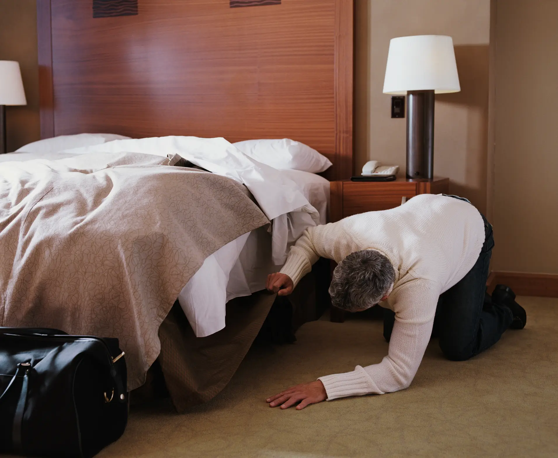Rolling a bottle under the bed prevents you from having to crouch down and see for yourself (Getty Stock)