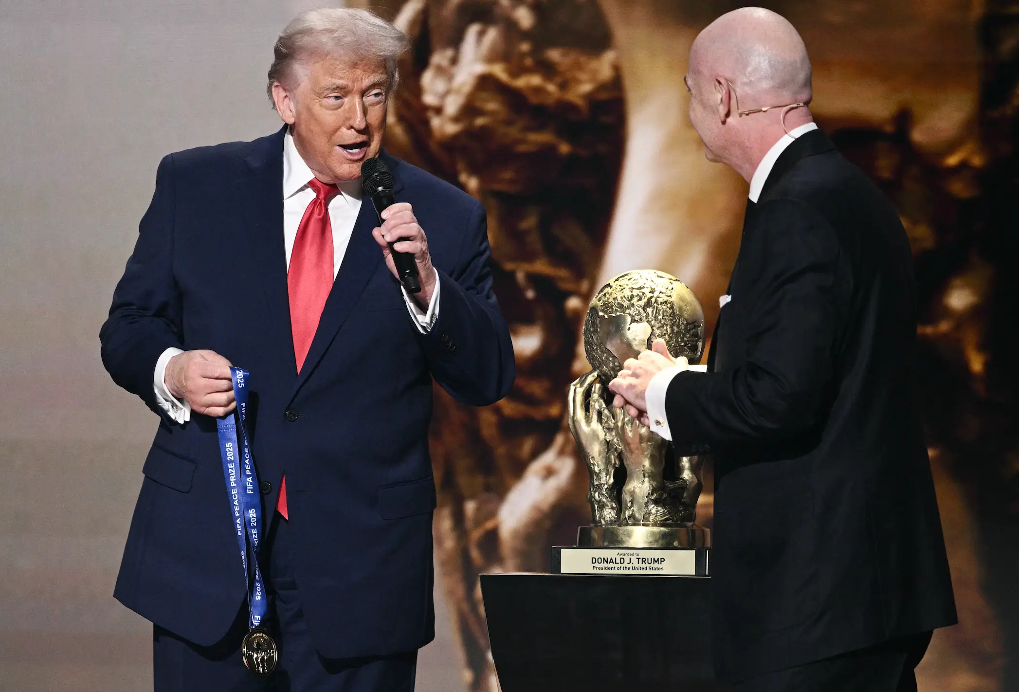 Donald Trump accepting his award at the ceremony (Brendan SMIALOWSKI / AFP via Getty Images)