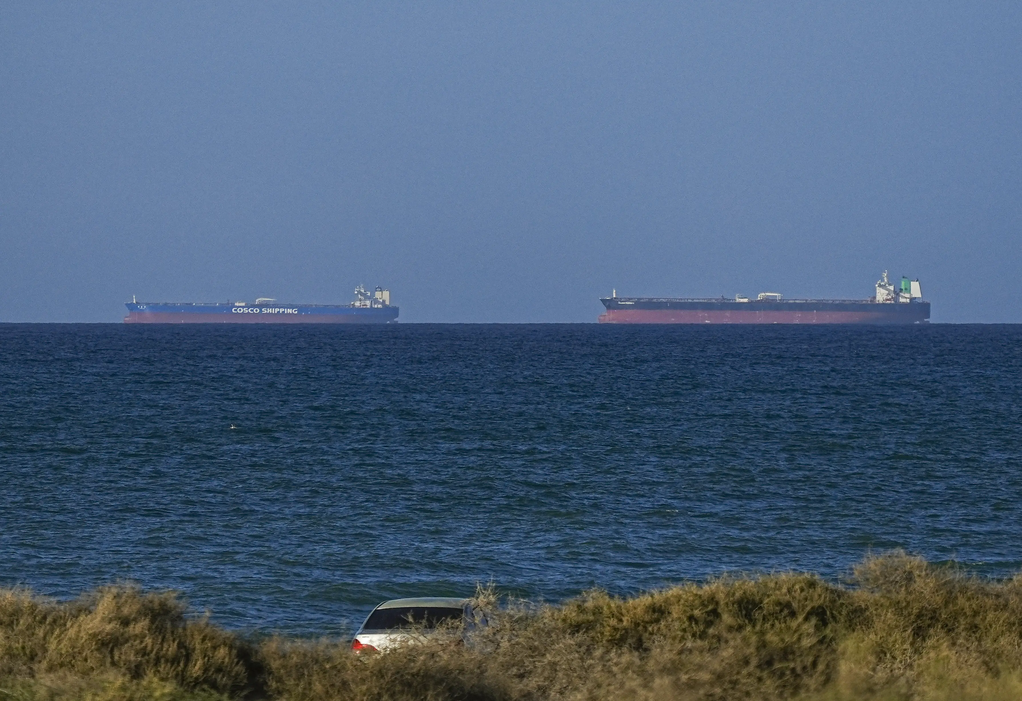 A handful of ships have been making it through the Strait of Hormuz each day, after paying a hefty fee to Iran (Shady Alassar/Anadolu via Getty Images)