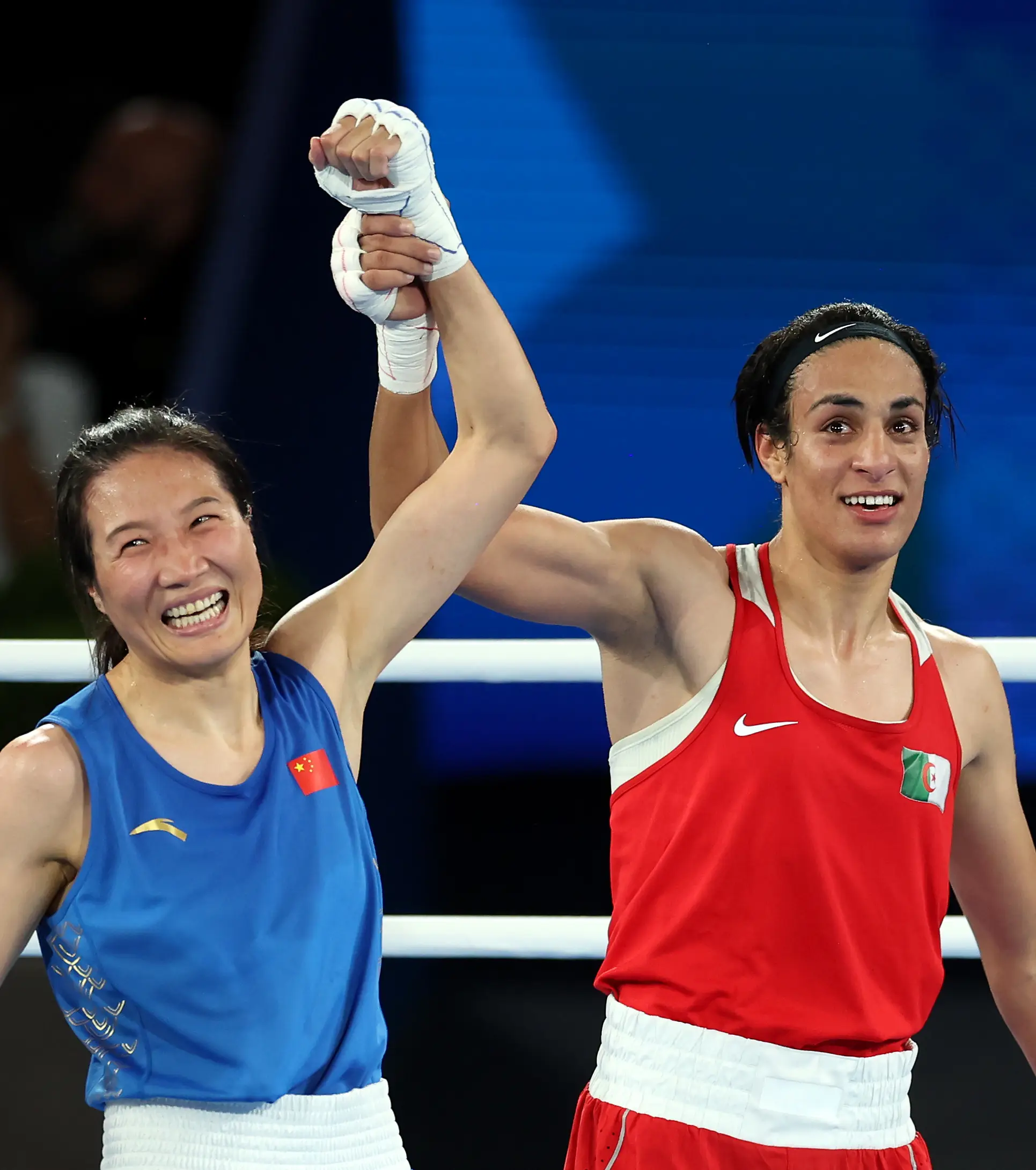 Imane Khelif and Yang Liu celebrate the final of the women's welterweight division. (Maja Hitij/Getty Images)