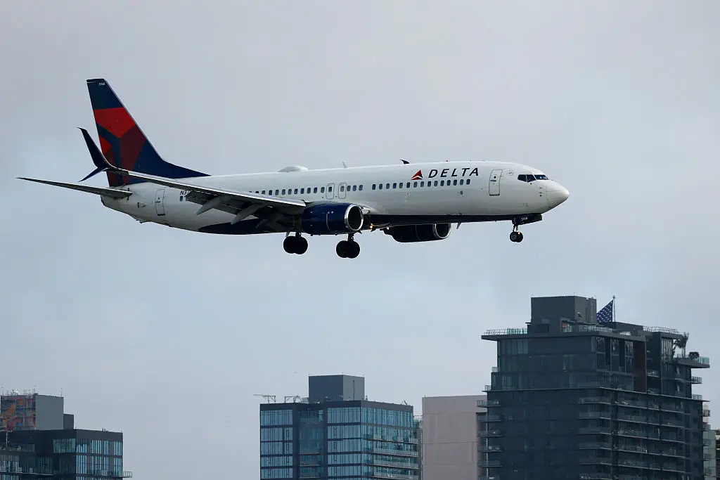 The Delta flight was delayed by an hour following the disruptive behavior. (Kevin Carter/Getty Images)