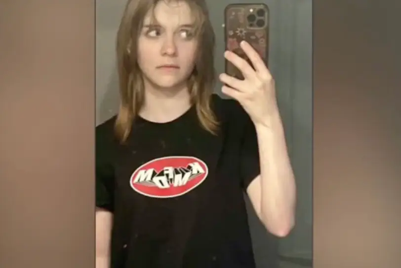 A picture of the 15-year-old sees her wearing a KMFDM t-shirt (@TheNationalDesk/YouTube)
