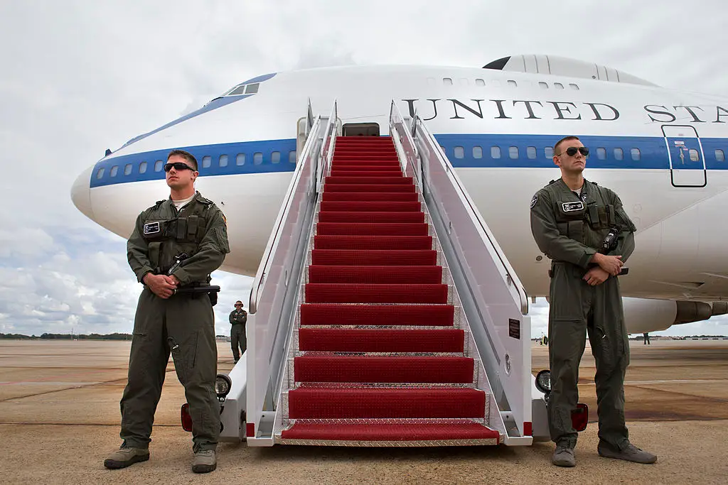 The E-4B is the US Air Force's militarized version of a Boeing 747 and it towers 63.5 feet above members of the US Air Combat Command Security Forces guarding it during a trip to South Korea in 2013 (Jacquelyn Martin-Pool/Getty Images)