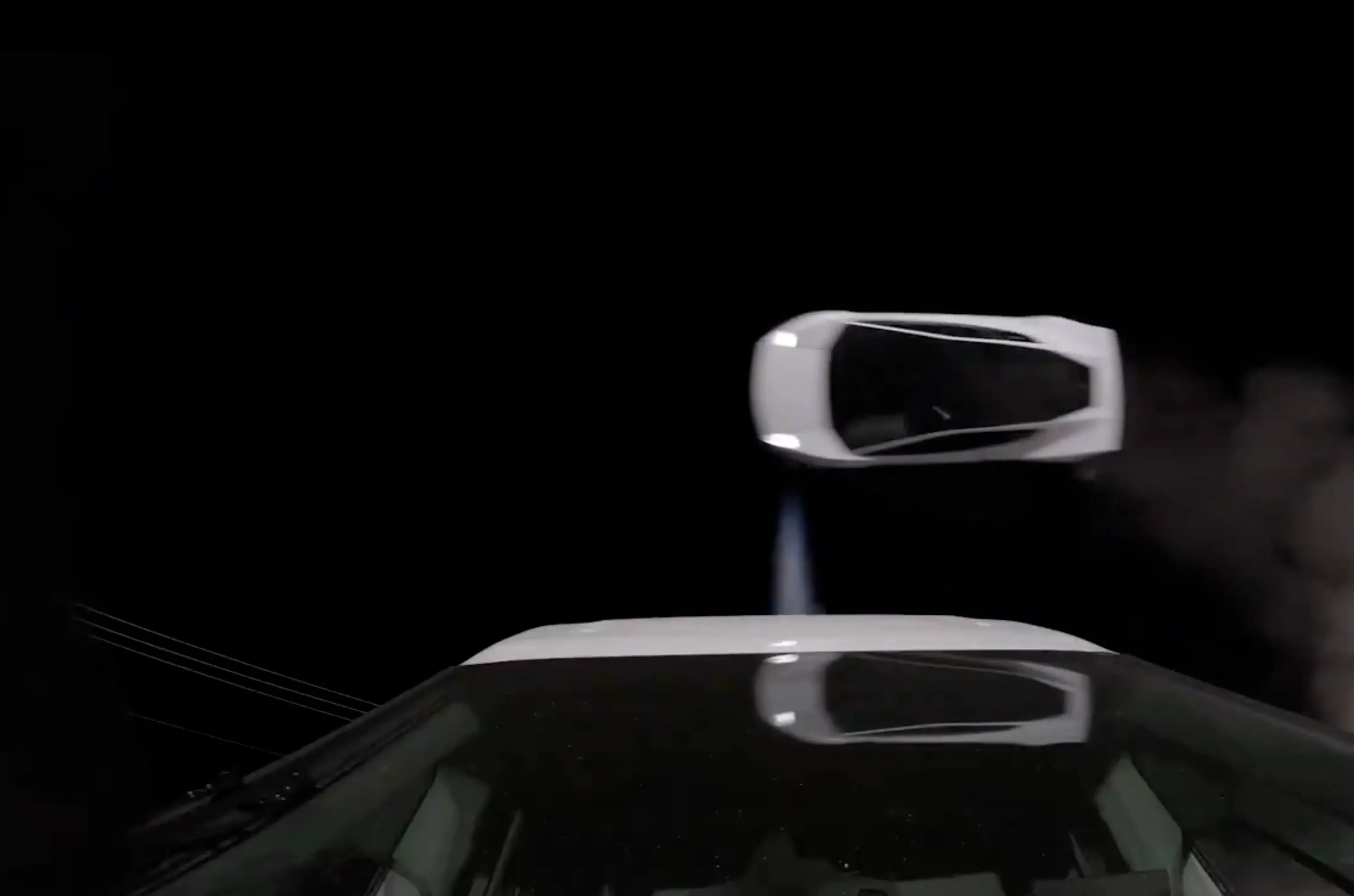 The car could be seen 'flying' over parked cars (X/Elon Musk/Tesla)