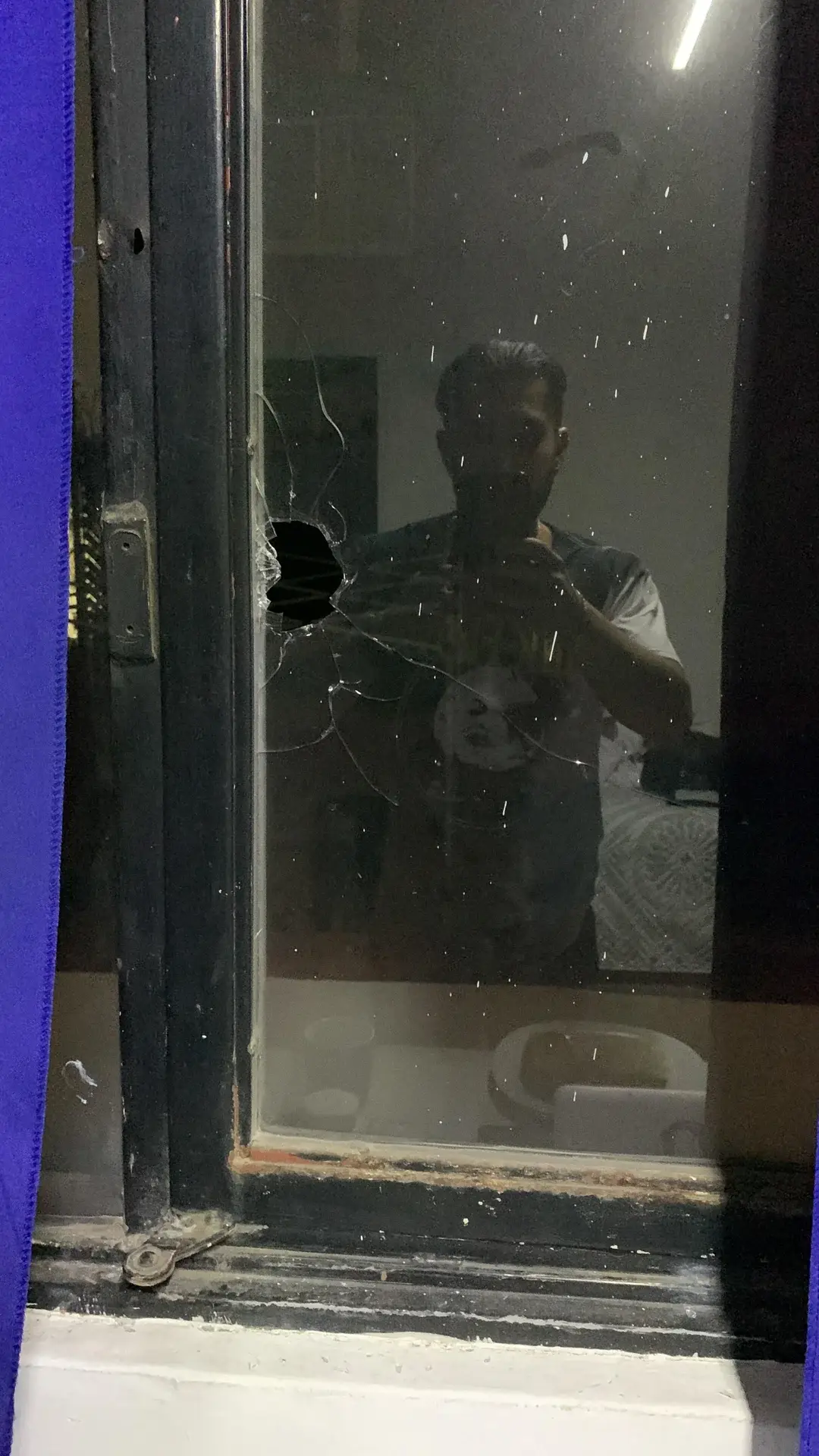 The window the bullet shattered to enter his room (Reddit/MartyMcFly_01)