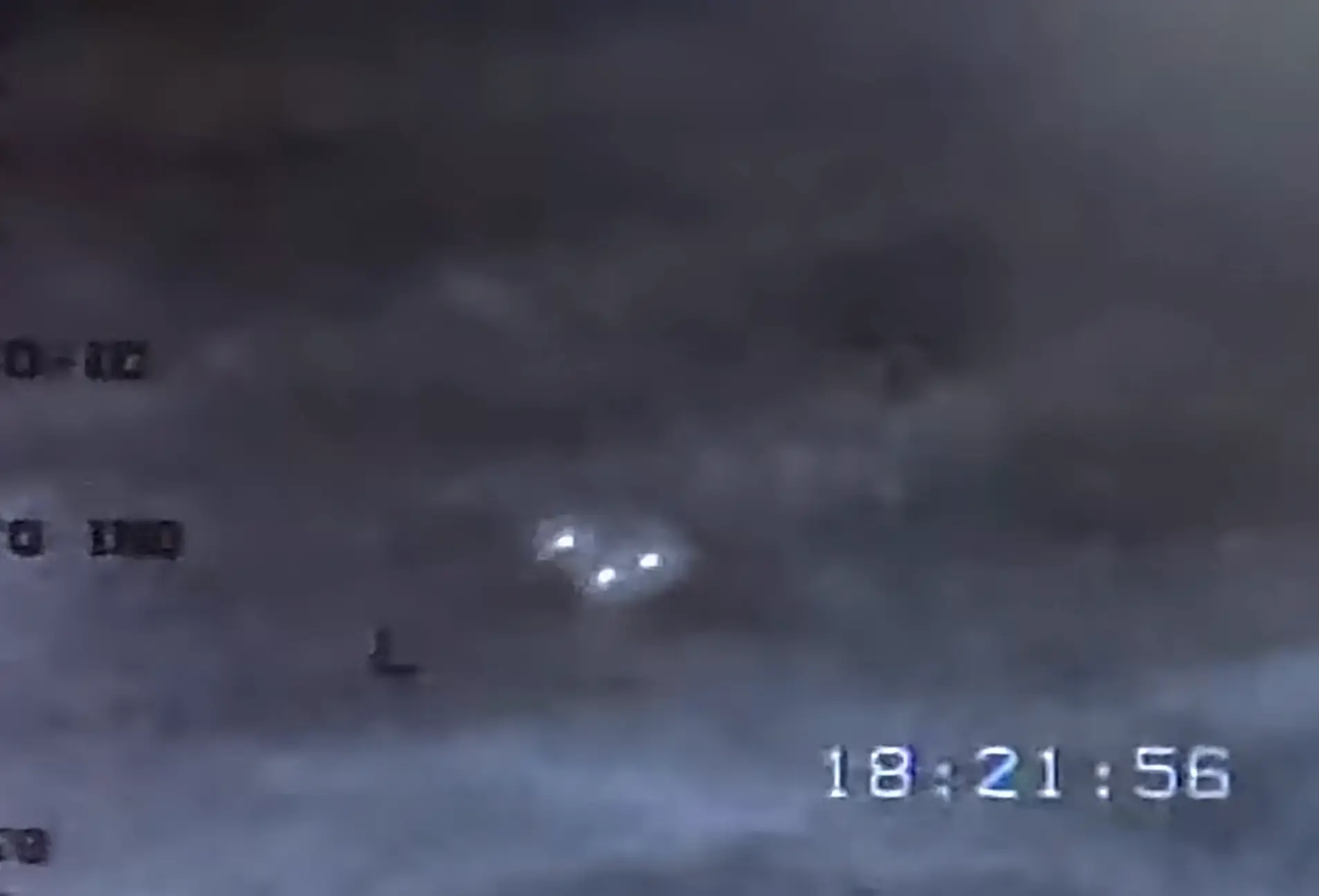 There appears to be three distinct lights in the sky (Weaponized Podcast Clips/YouTube)