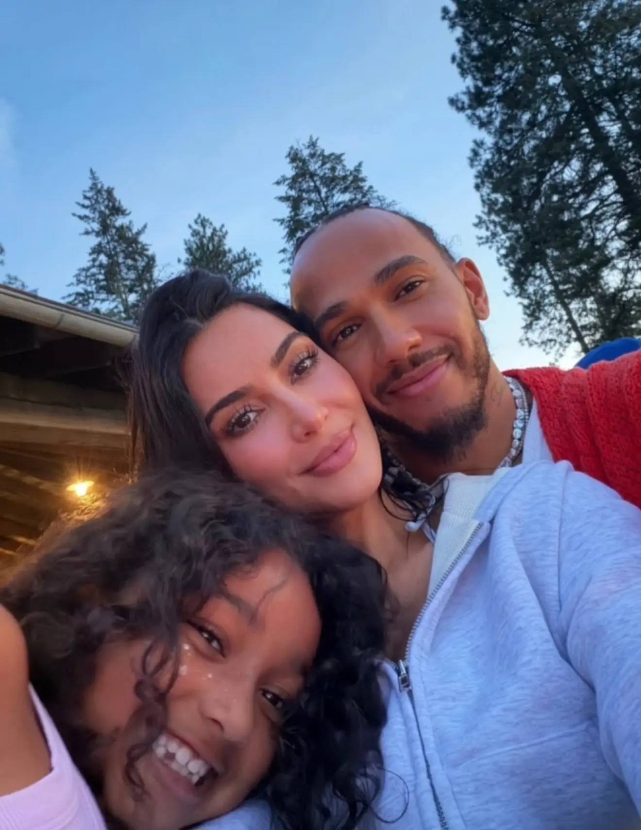 The timing of the announcement clashed with a photo dump of her and Hamilton on vacation. (@kimkardashian/Instagram)