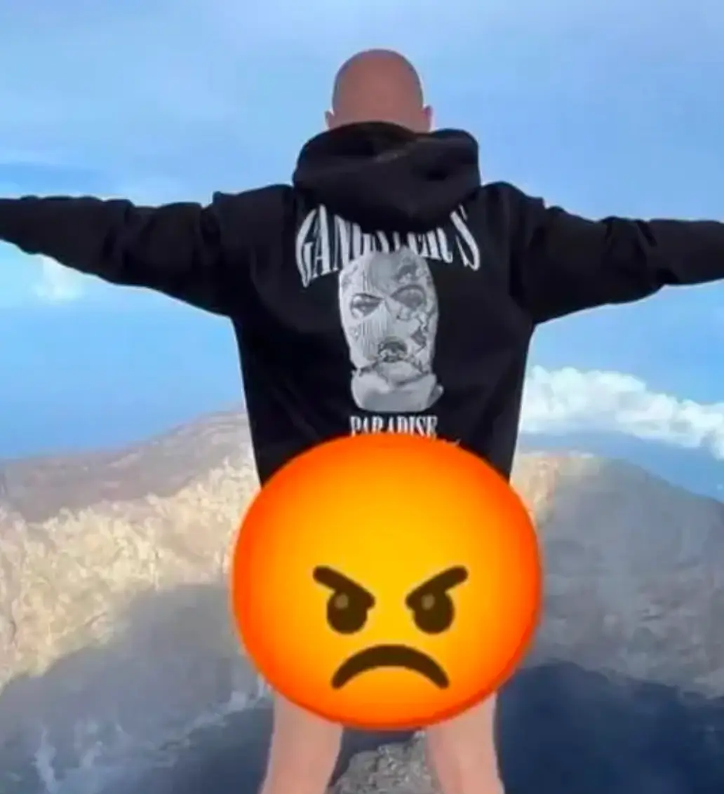 The Russian tourist was deported after the half-naked photo went viral.