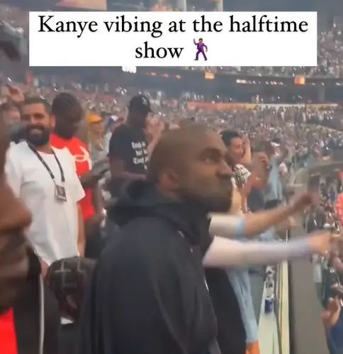 Kanye West seen bopping along to Eminem's Super Bowl Halftime show (@justinlaboy/Instagram)