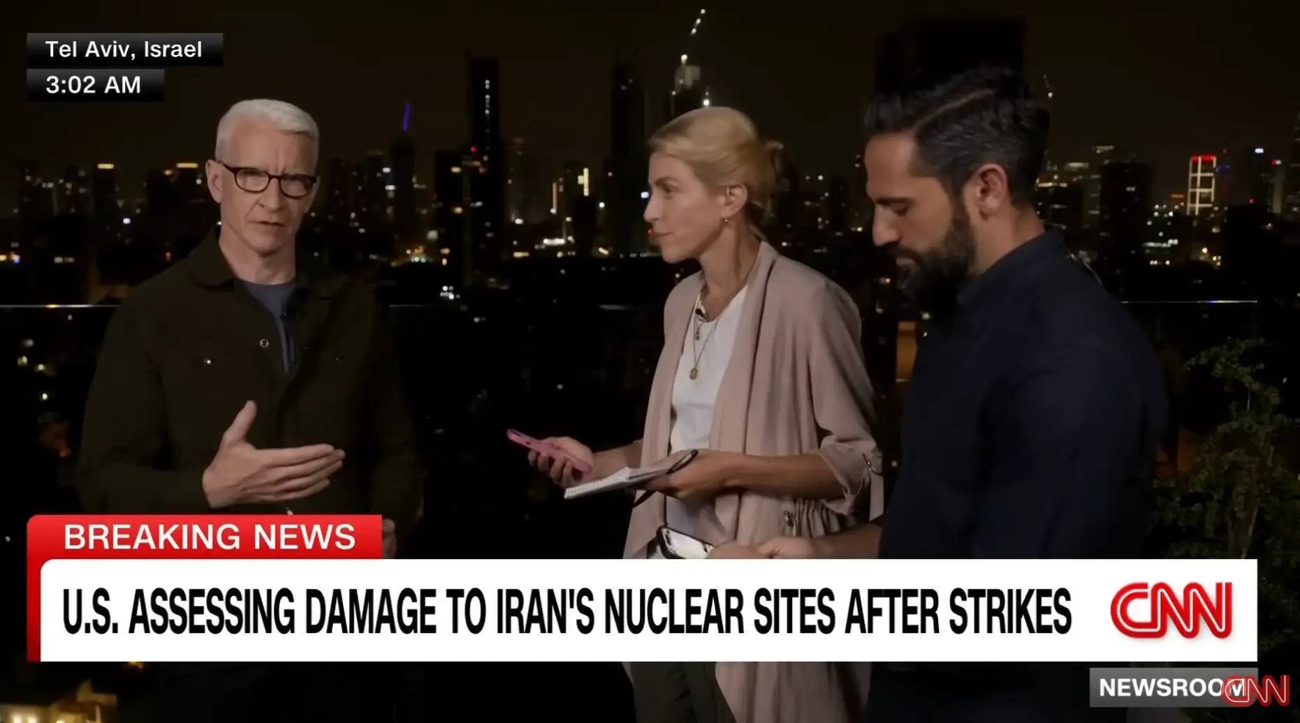 Siren sounds rang out from their phones during the report (CNN)