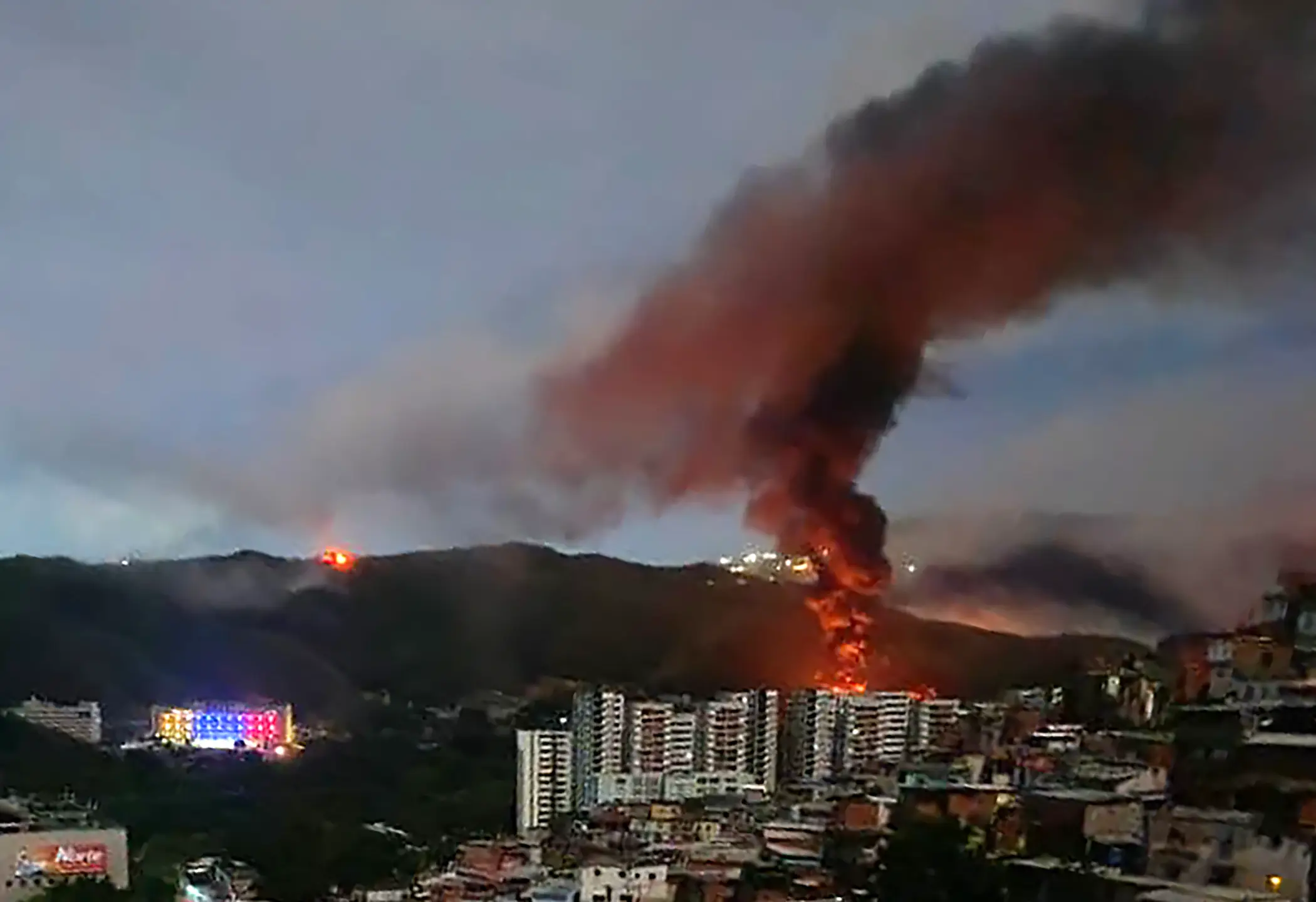 Residents in Caracas woke up to a smoke-filled skyline (AFP via Getty Images)