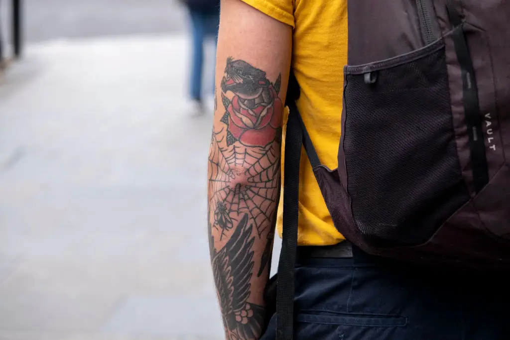 Elbow web tattoos have long been associated with prison culture (Mike Kemp/Contributor/Getty Images)