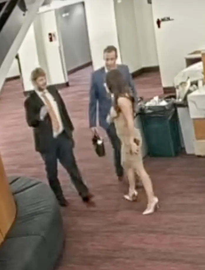 Staff escort Boebert and her companion from the theater.