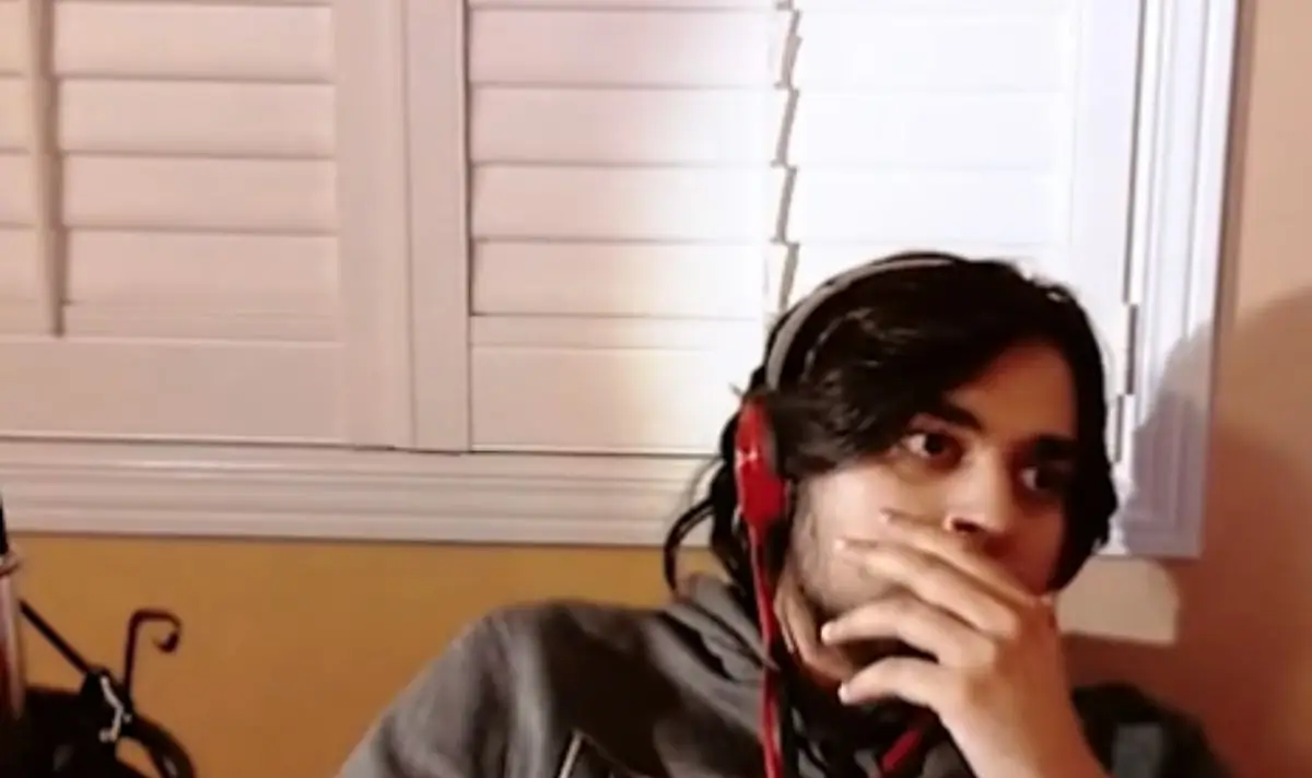 The creator sat in silence as he digested the video. (YouTube/SomeOrdinaryGamers)