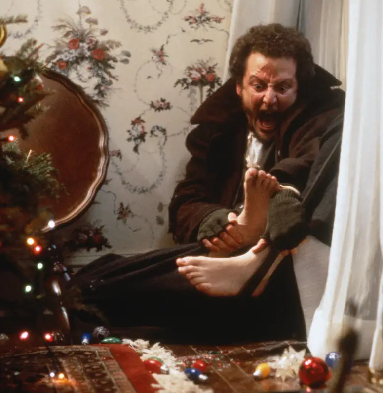 Marv's foot becomes a sore spot after standing on baubles (20th Century Fox)
