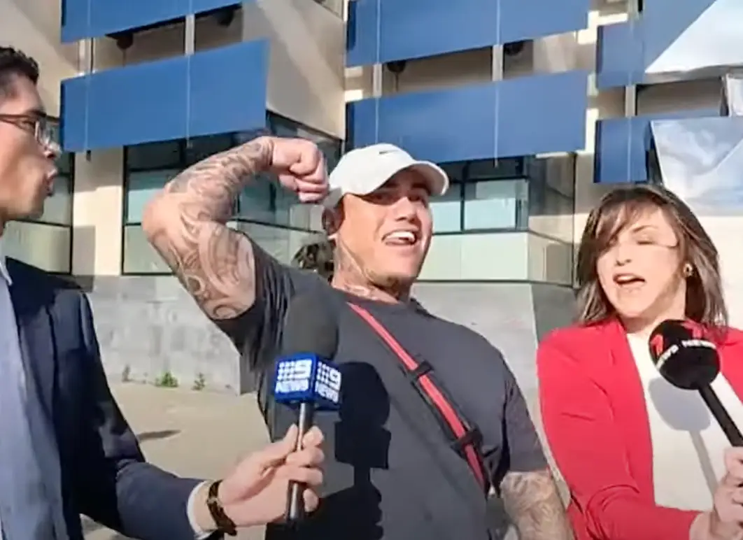 Wade Corbett showed off his bicep when questioned by reporters (9News)