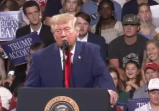 Rylan Ferguson was sat behind Trump at the University of Alabama rally (X/@RSBN)