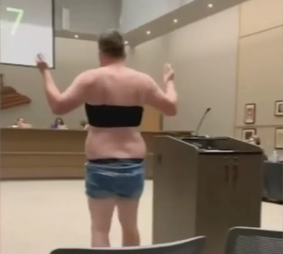 Latham, who has four children in the Higley Unified School District in Arizona, pulled his stunt in late September during a school board meeting.