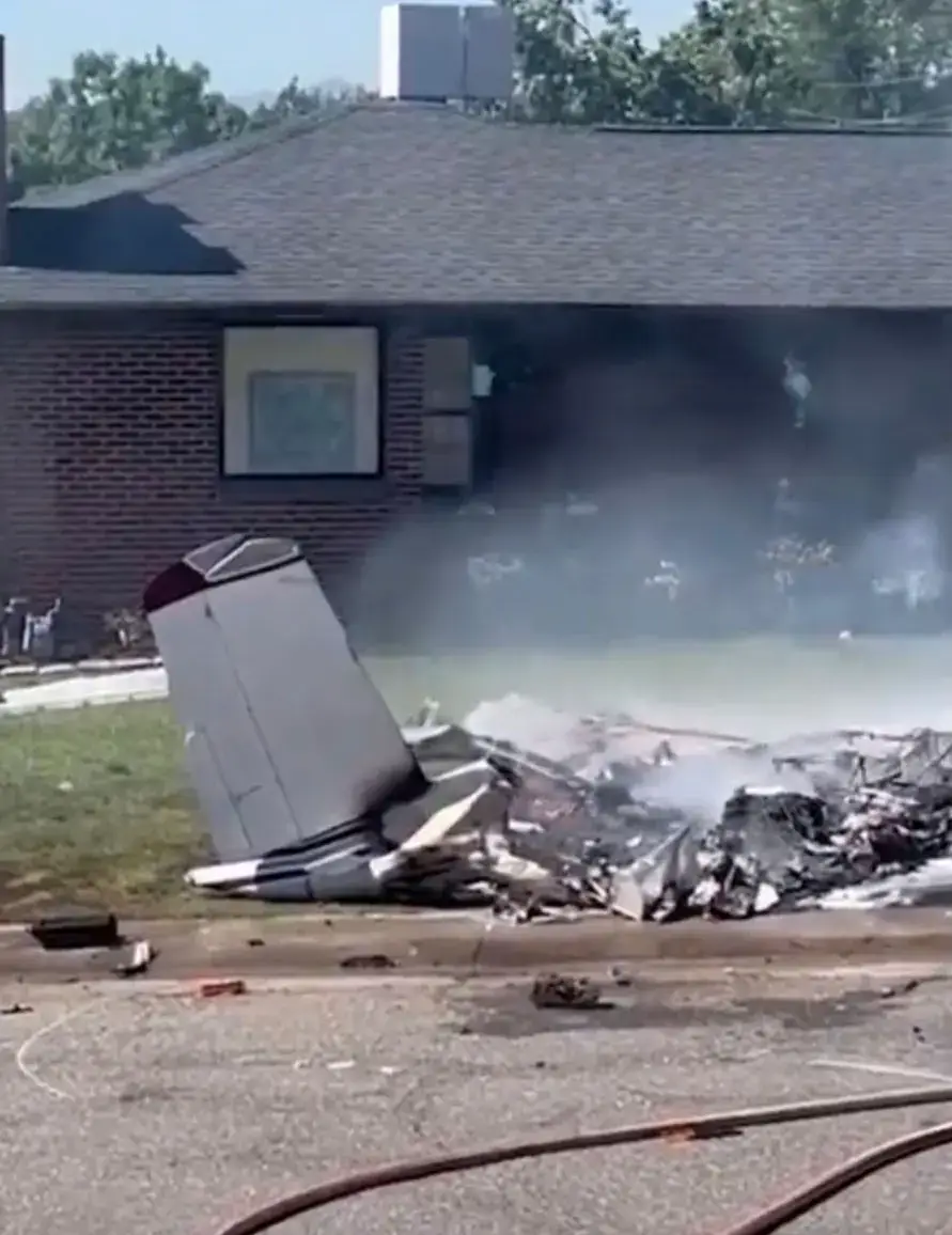 The plane came to rest in a front garden. (FOX 31)