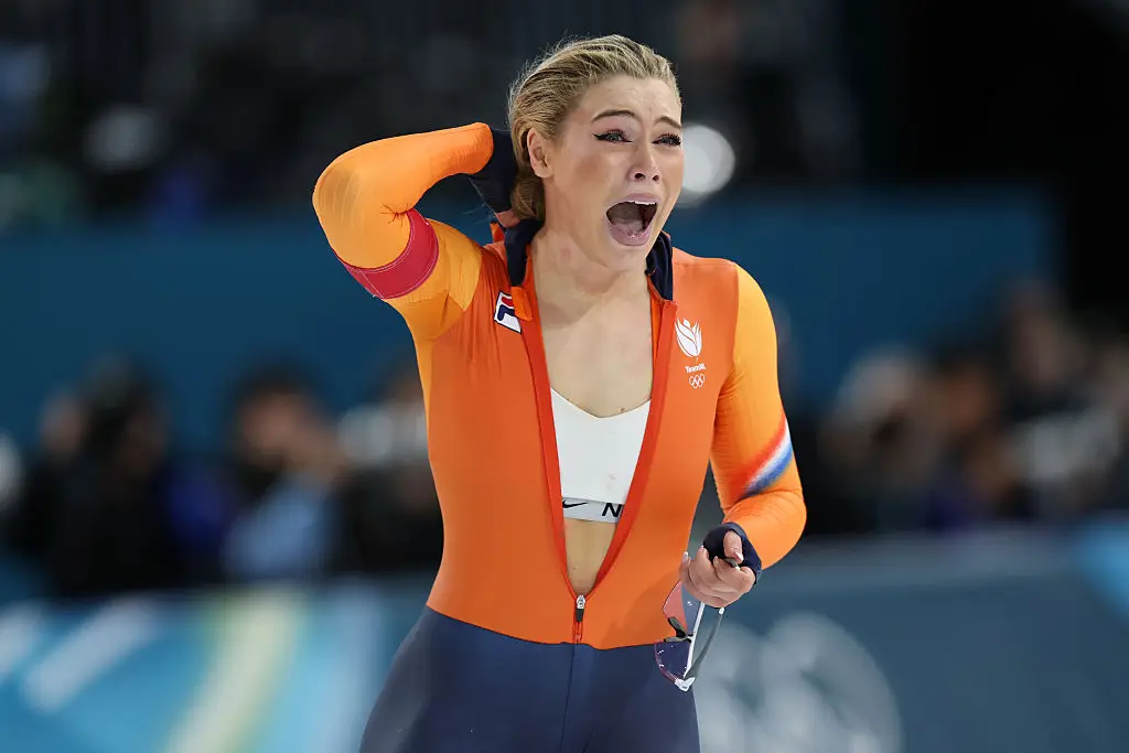 Jutta celebrated her gold win, and was photographed unzipping her racing suit to reveal a Nike sports bra (Jiang Qiming/China News Service/VCG via Getty Images)