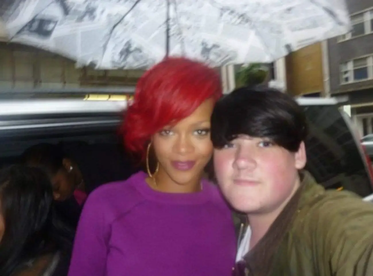 Yes, that's Rihanna under an umbrella.