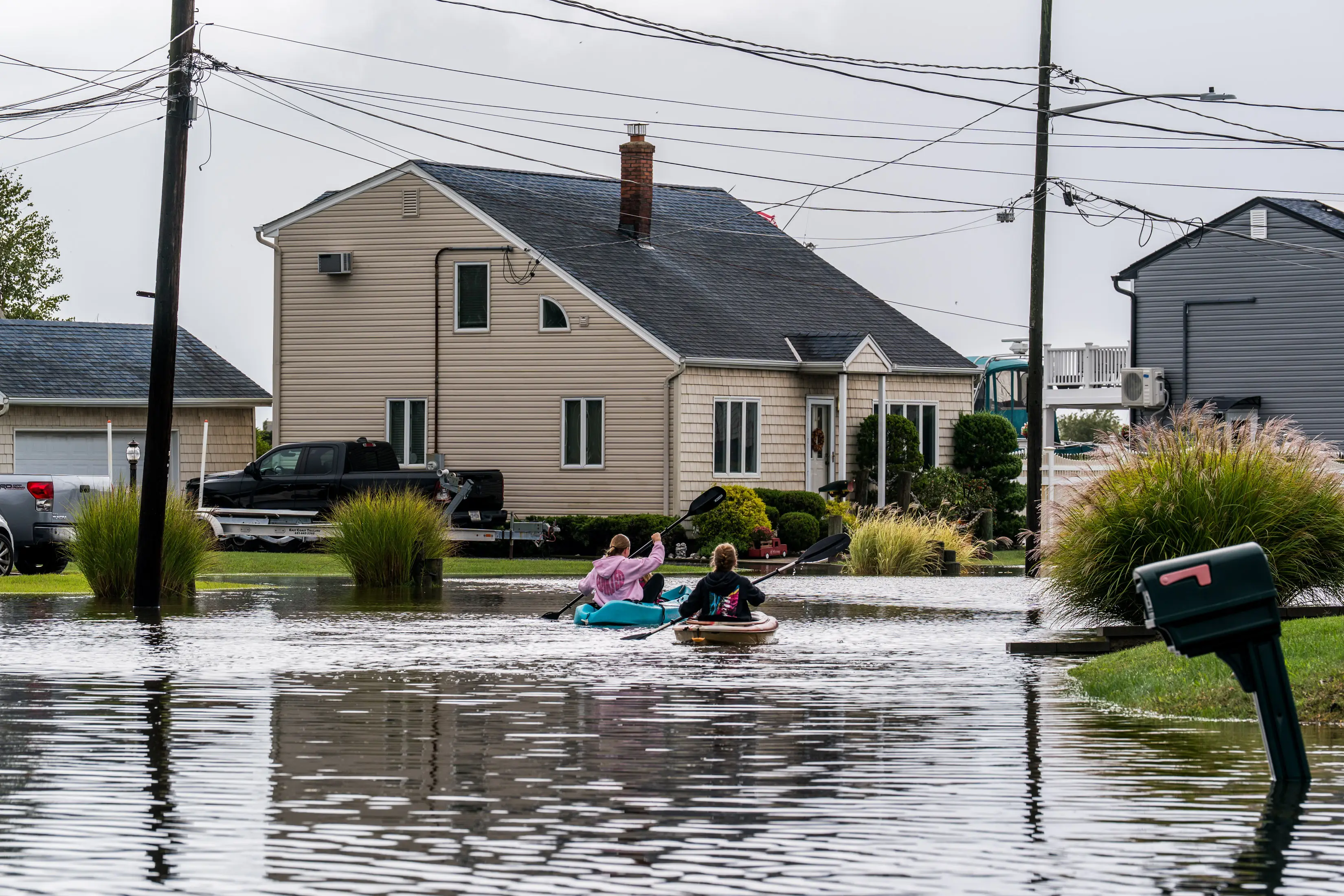 Long Island residents were forced to resort to kayaking down their flooded streets (Thomas Hengge/Anadolu via Getty Images)