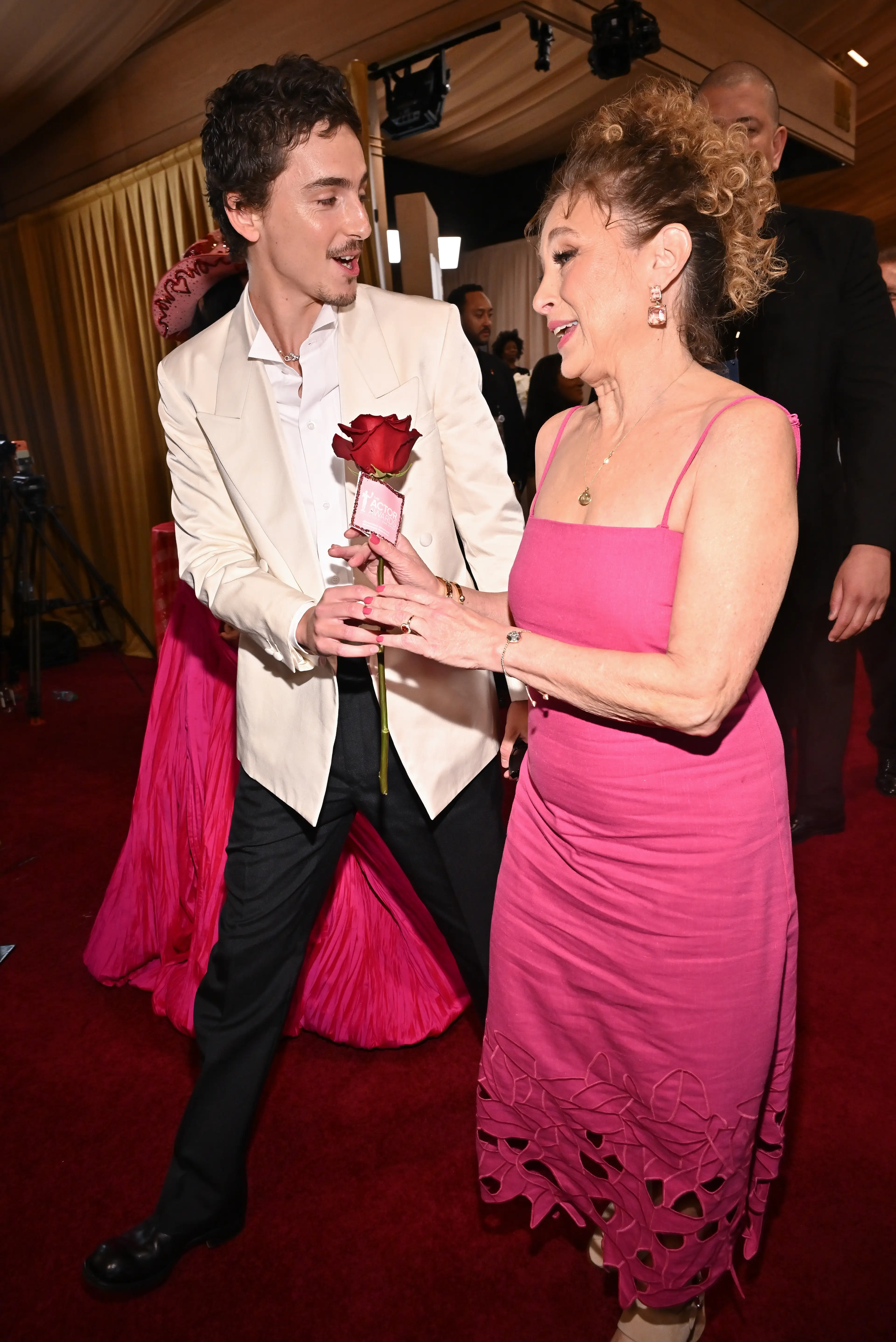 Chalamet made sure to treat his mom to a red rose on the red carpet (Michael Buckner/Variety via Getty Images)