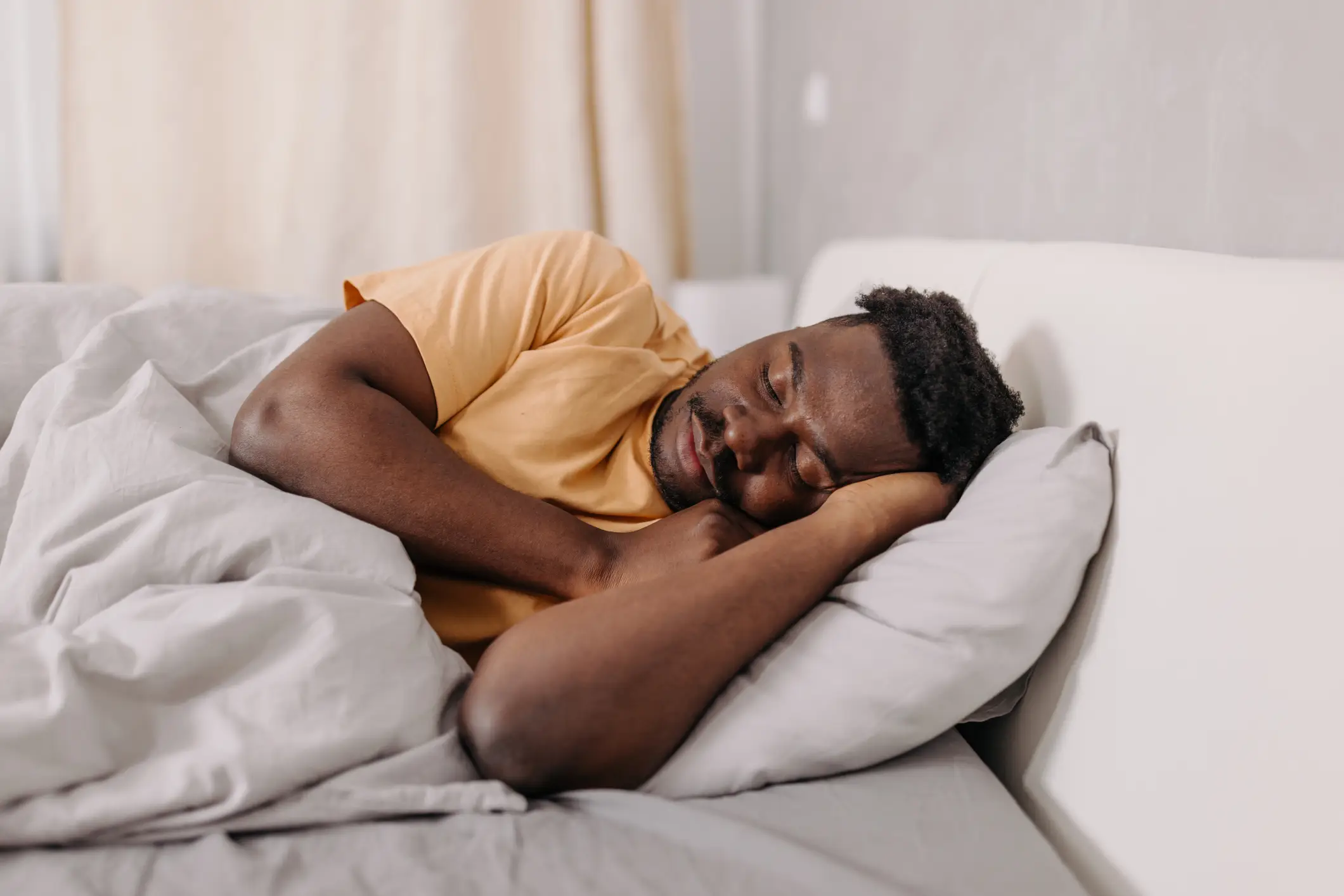 Studies have found that those who sleep on their left side are more likely to have nightmares (Getty Stock)