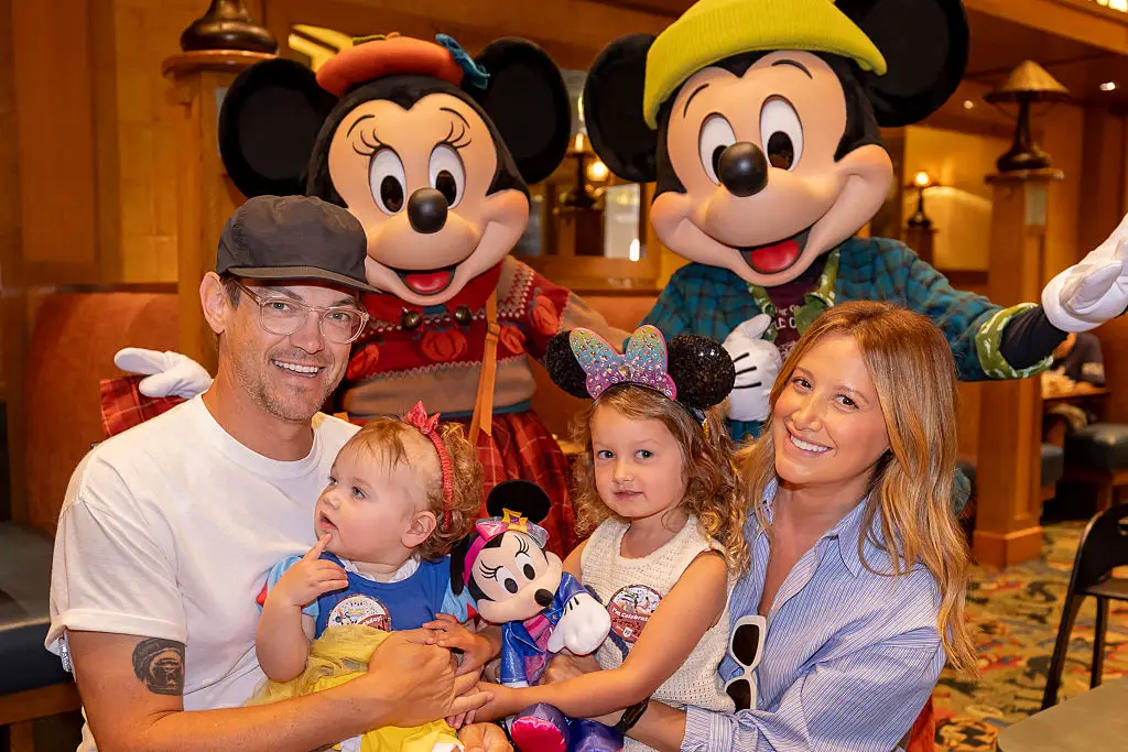 Ashley French, née Tisdale, with her two young children and husband Christopher French (Christian Thompson/Disneyland Resort via Getty Images)
