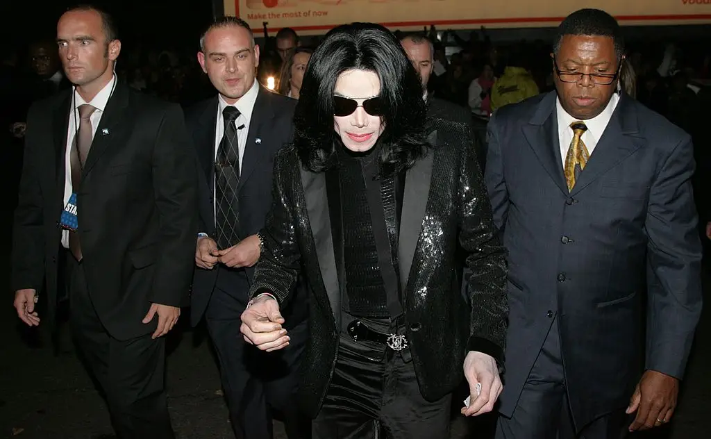 Simon Newton pictured far-left alongside Michael Jackson and his entourage of bodyguards, during the singer's visit to London for the World Music Awards in November 2006 (Getty Images/Getty Images)