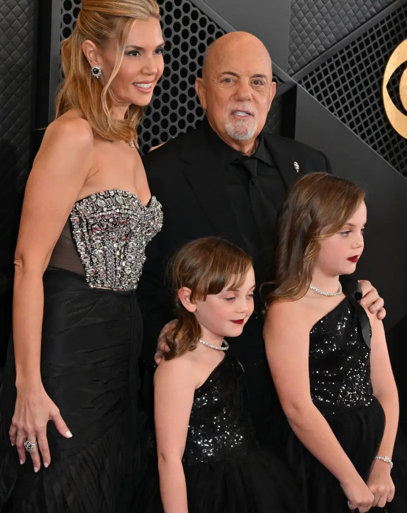 Billy Joel pictured in February last year with wife Alexis Roderick Joel, and their two daughters Remy Anne and Della Rose (ROBYN BECK/AFP via Getty Images)