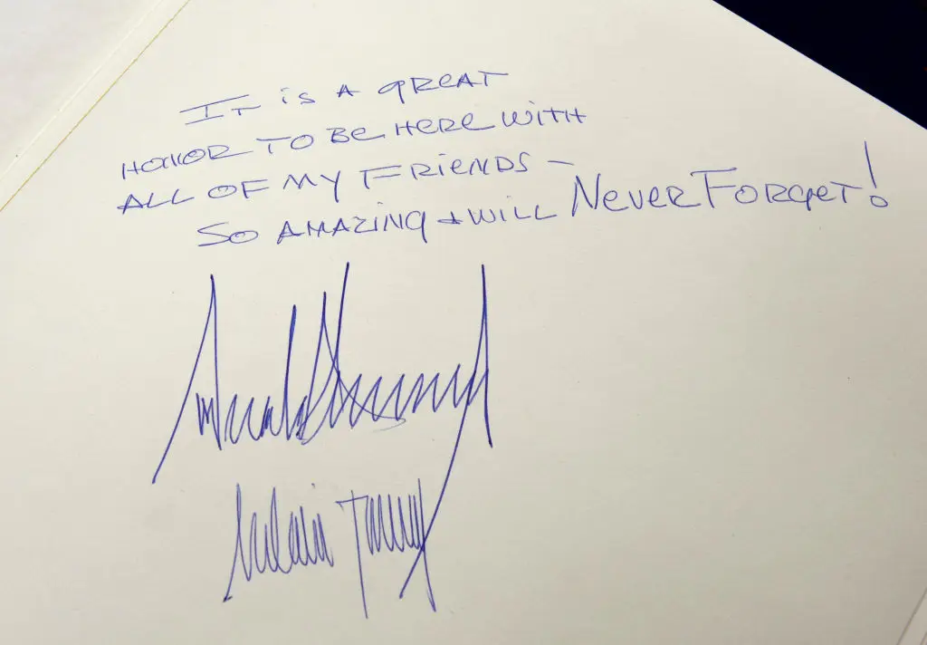 Donald (top) and Melania's signatures in the Yad Vashem Holocaust Memorial Museum guest book in 2017 (DEBBIE HILL/POOL/AFP via Getty Images) 