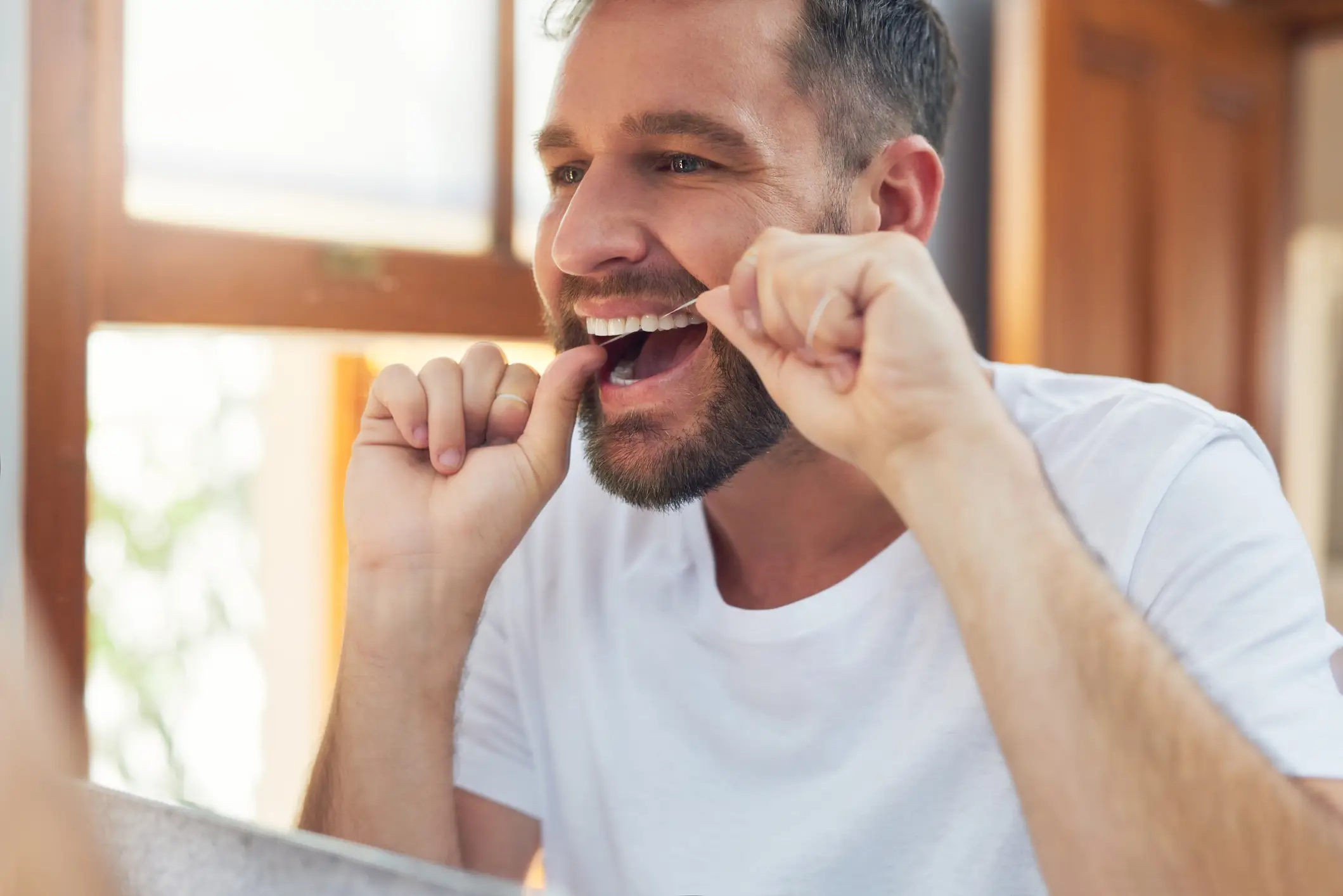 Experts recommend flossing at least once a day (Getty Stock Image)