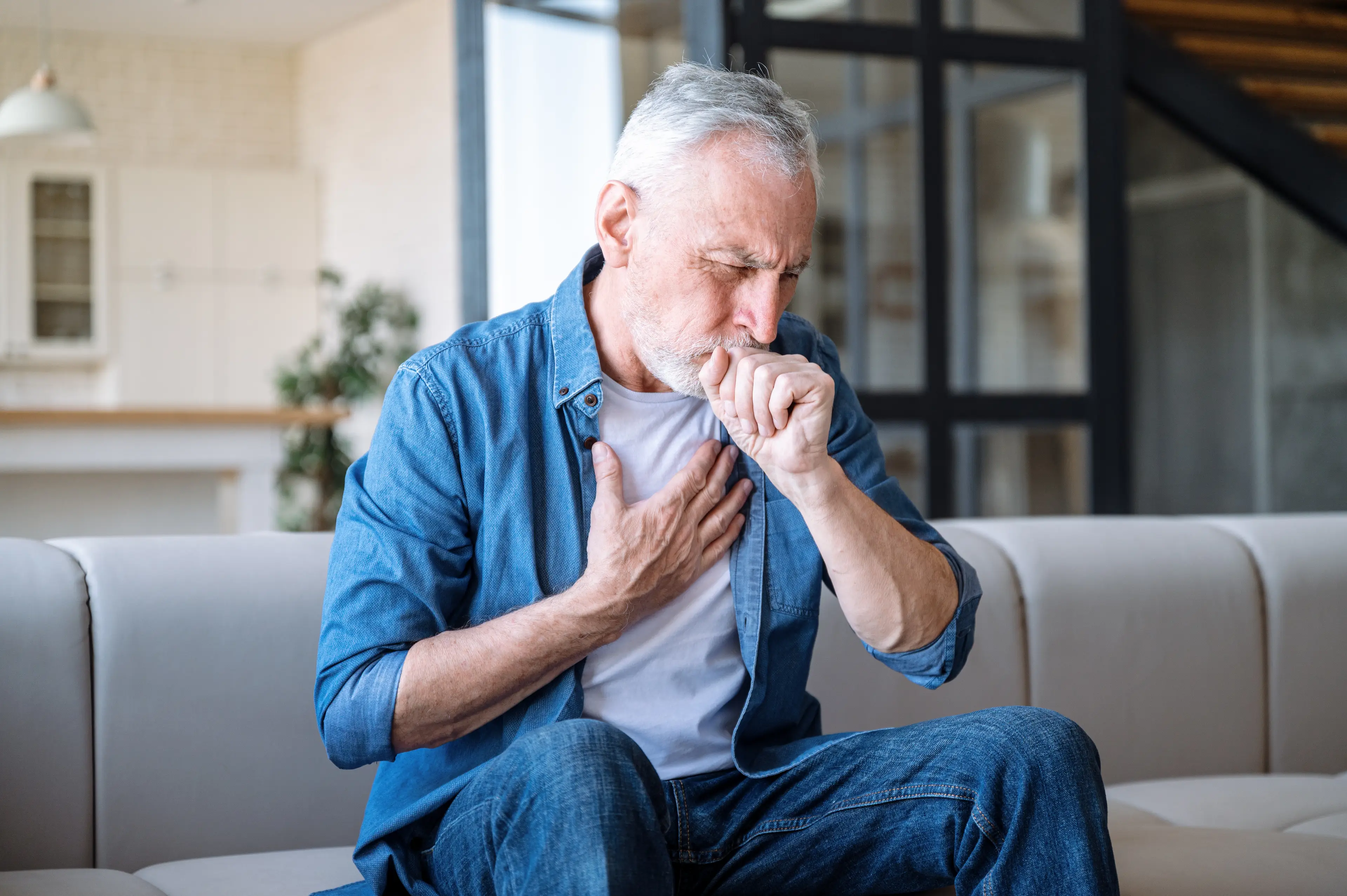 According to the GP, you should be paying the doctors a visit if you've had a 'persistent cough' for three weeks (Getty Stock Image)